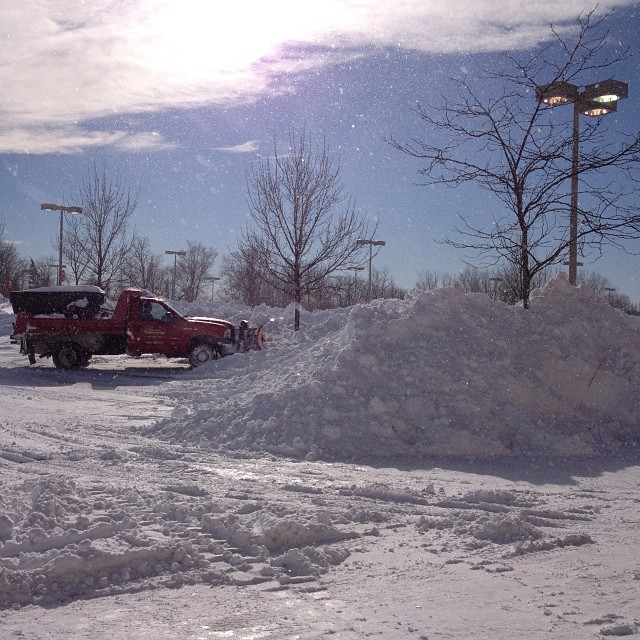 snow plow clearing snow in the morning