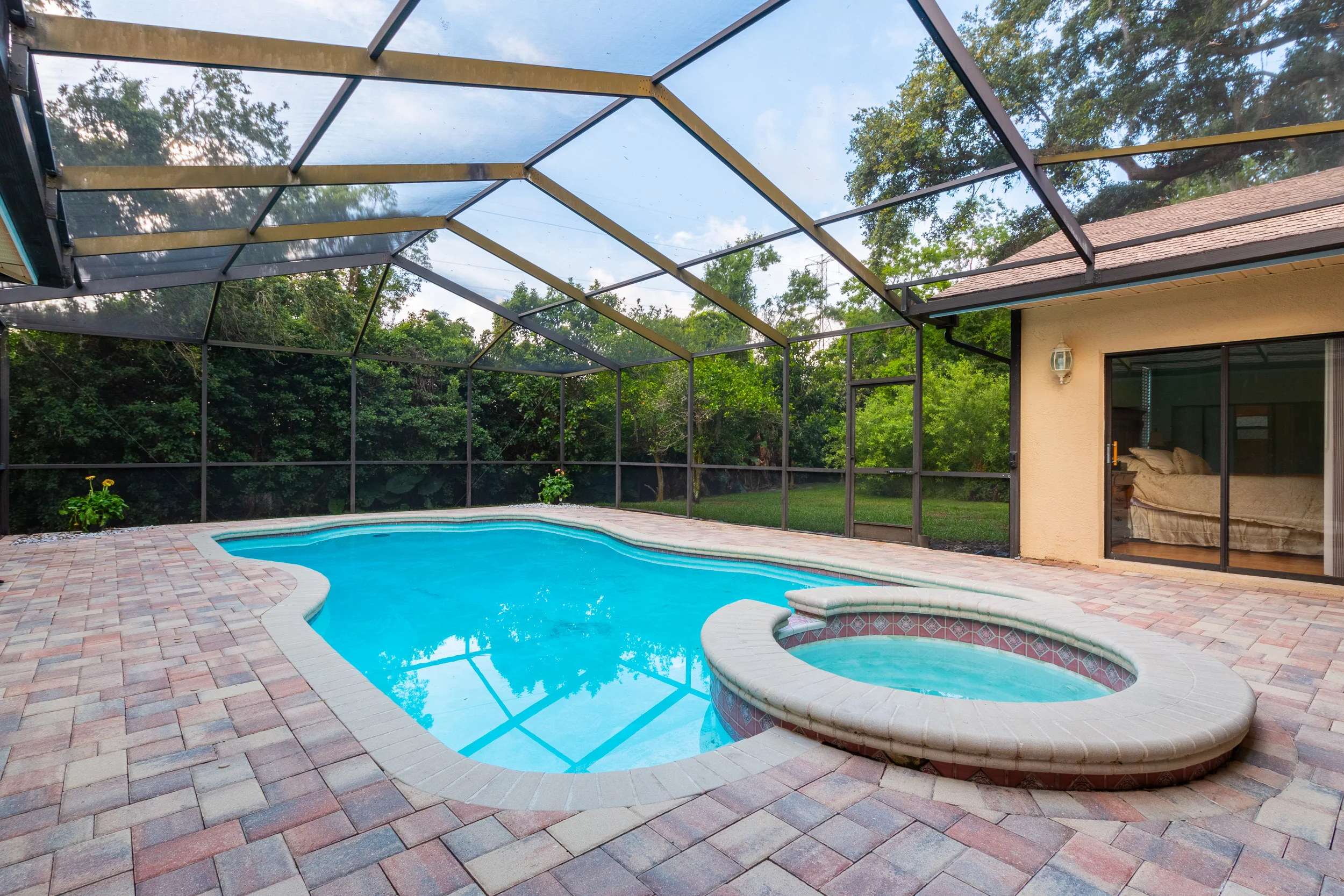 A deep blue pool within a porch