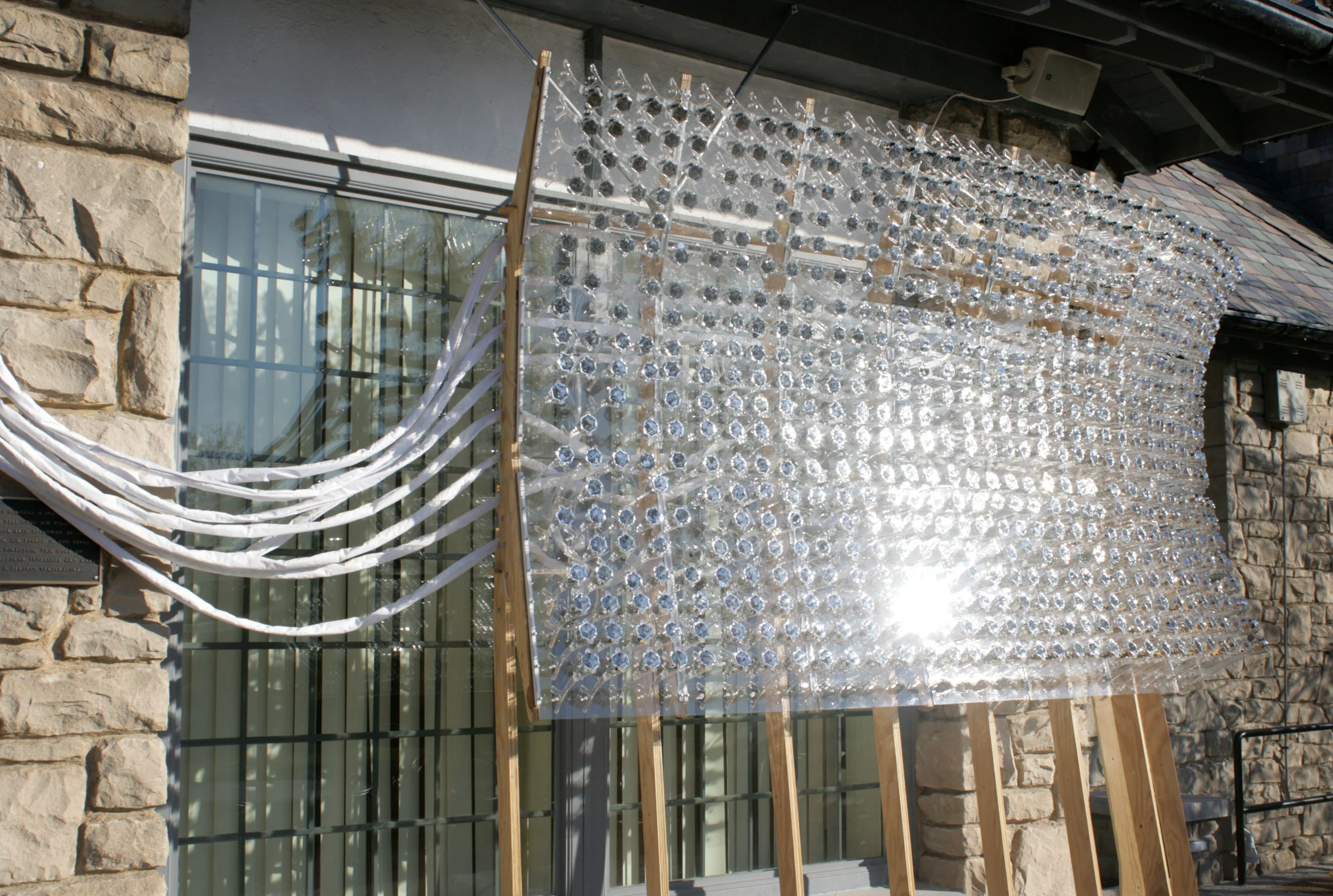Yo_Cy: Christine Yogiaman and Ken Tracy Loom Portal , 2011 fiber optic strands, metalized mylar, polypropylene, acrylic and plywood Photo by Shaun Alvey