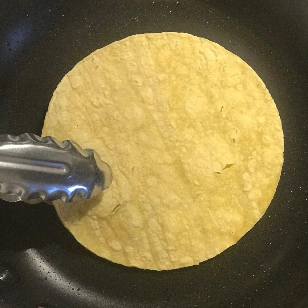 Heat tortillas in lightly oiled pan.