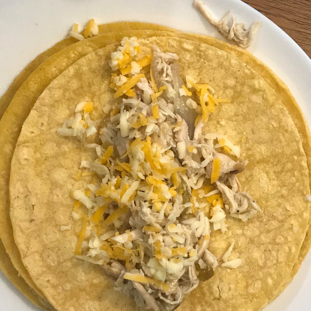 Fill tortillas with chicken and sprinkle with cheese.