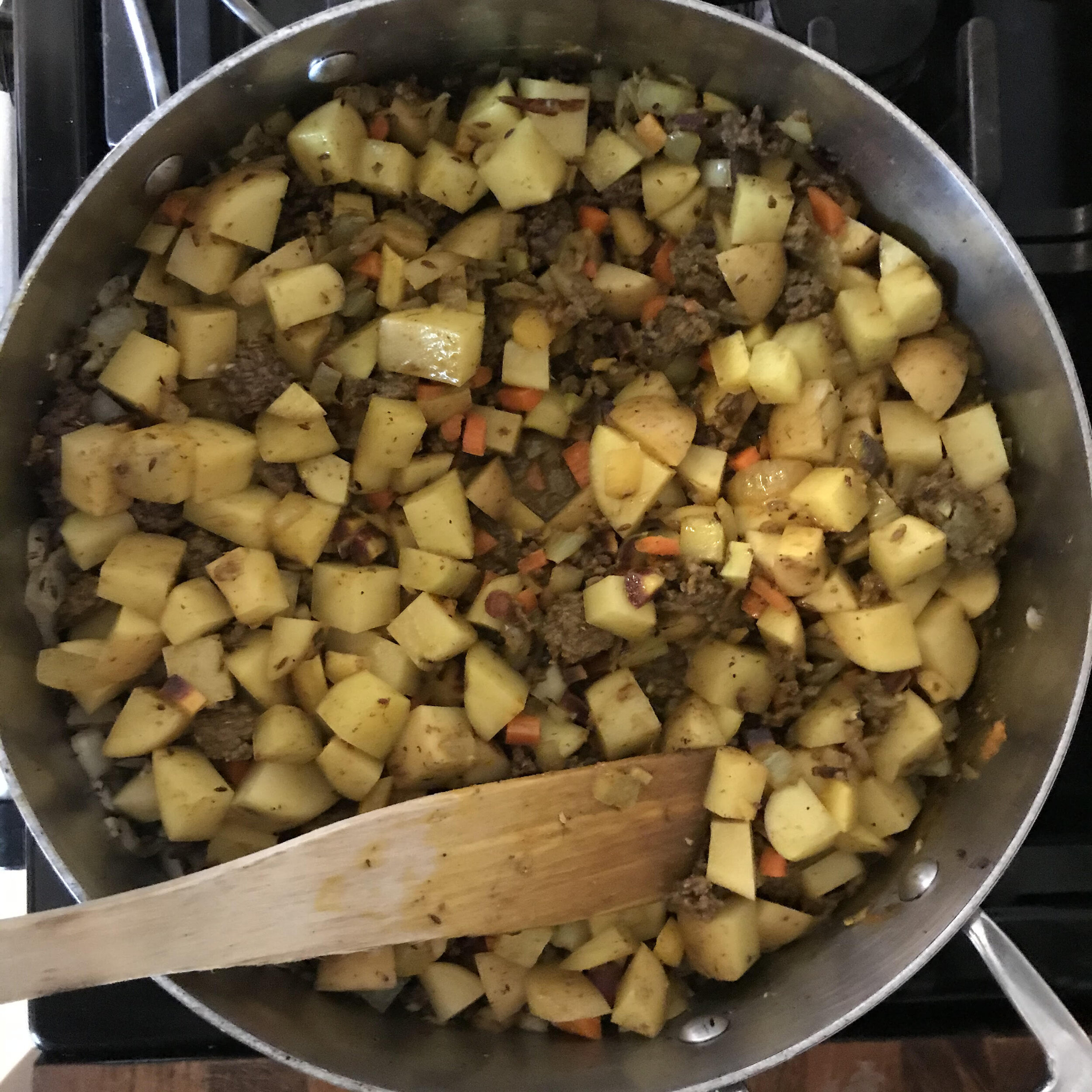 Add the potatoes and then the carrots