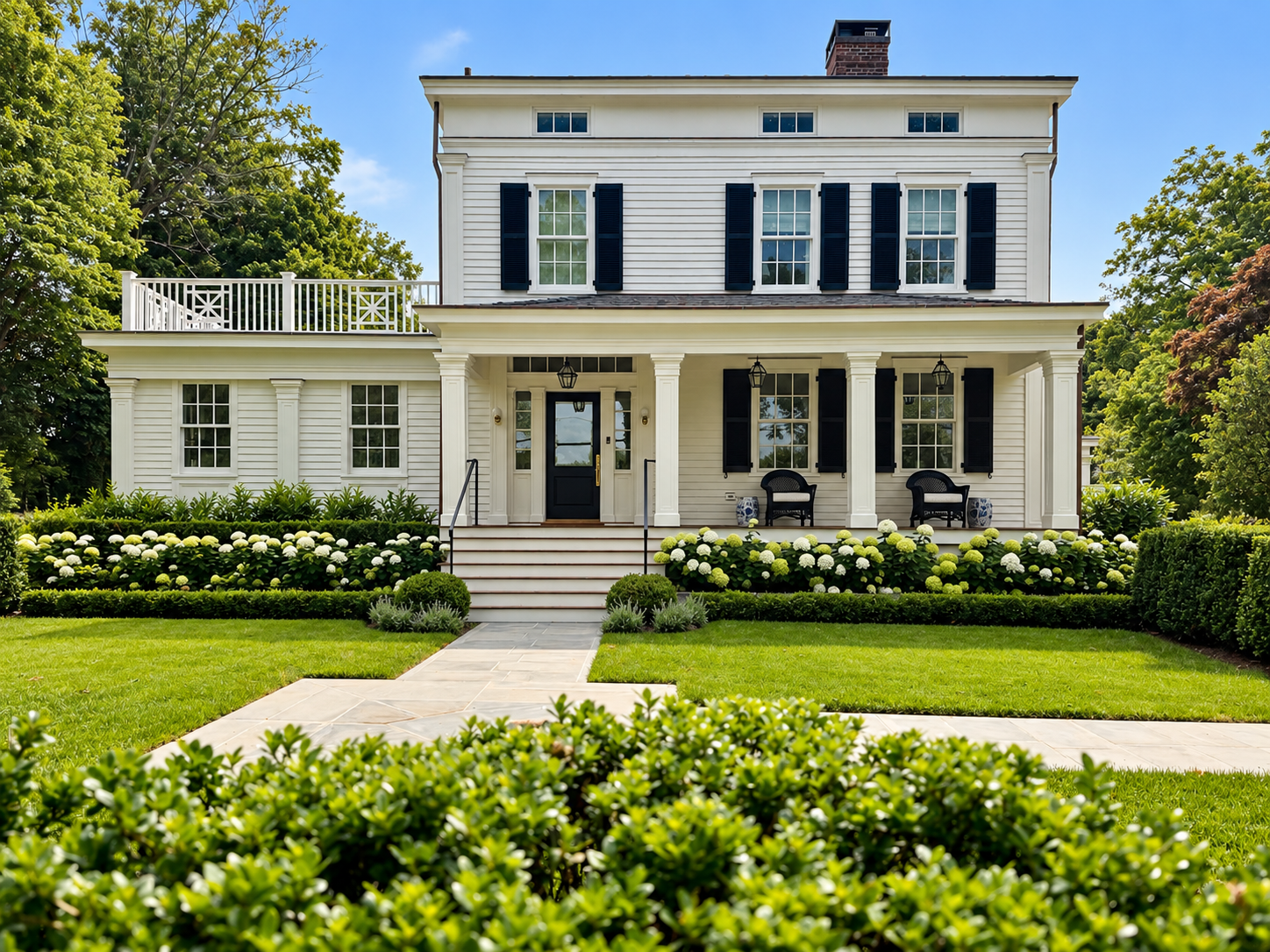 Classic White Colonial with Lush Gardens.png