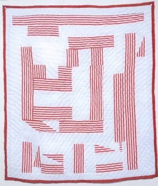 A Gee's Bend quilt in patriotic colors by Alabama Folk School instructor, Mary Ann Pettway. 