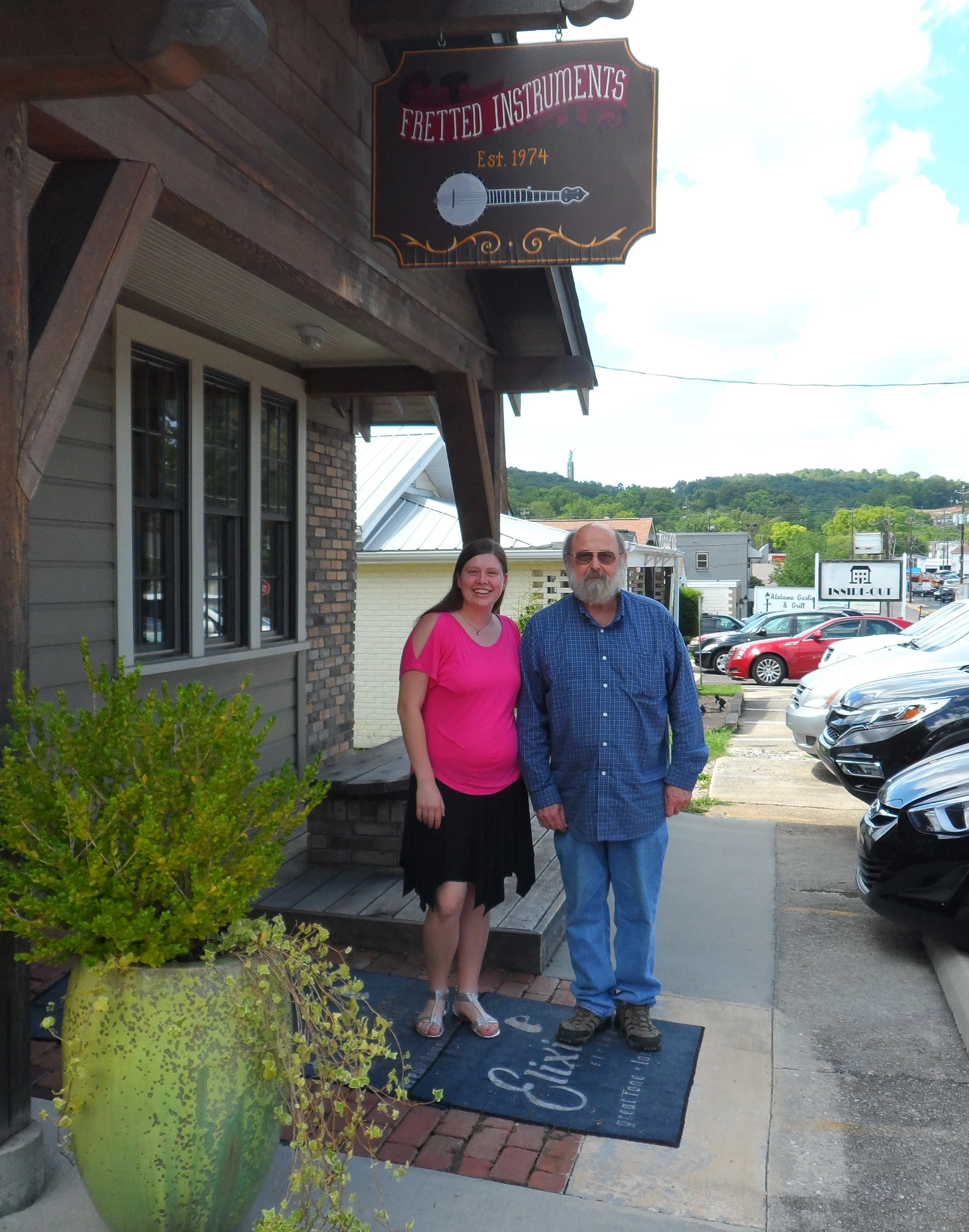Whitley visits with Herb Trottman at Fretted Instruments in Birgmingham.