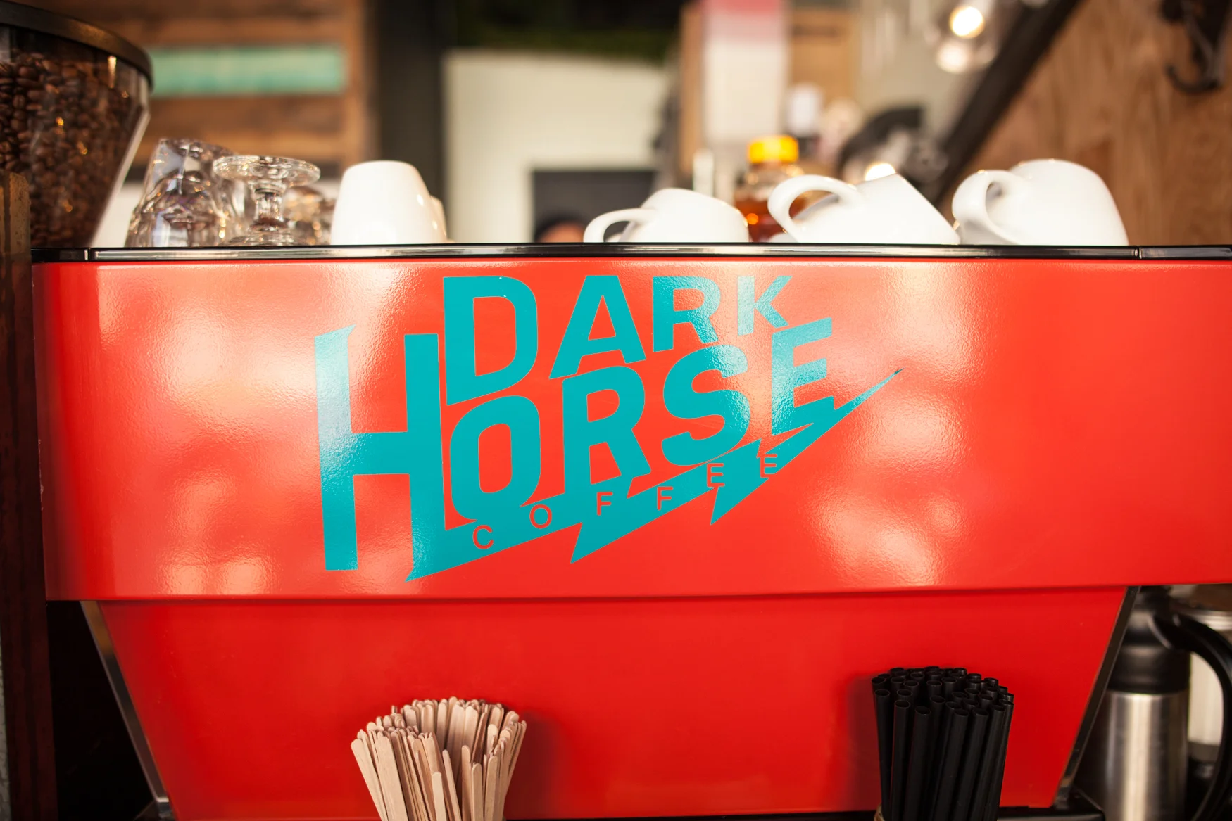 Red Espresso Machine And Dark Horse Logo