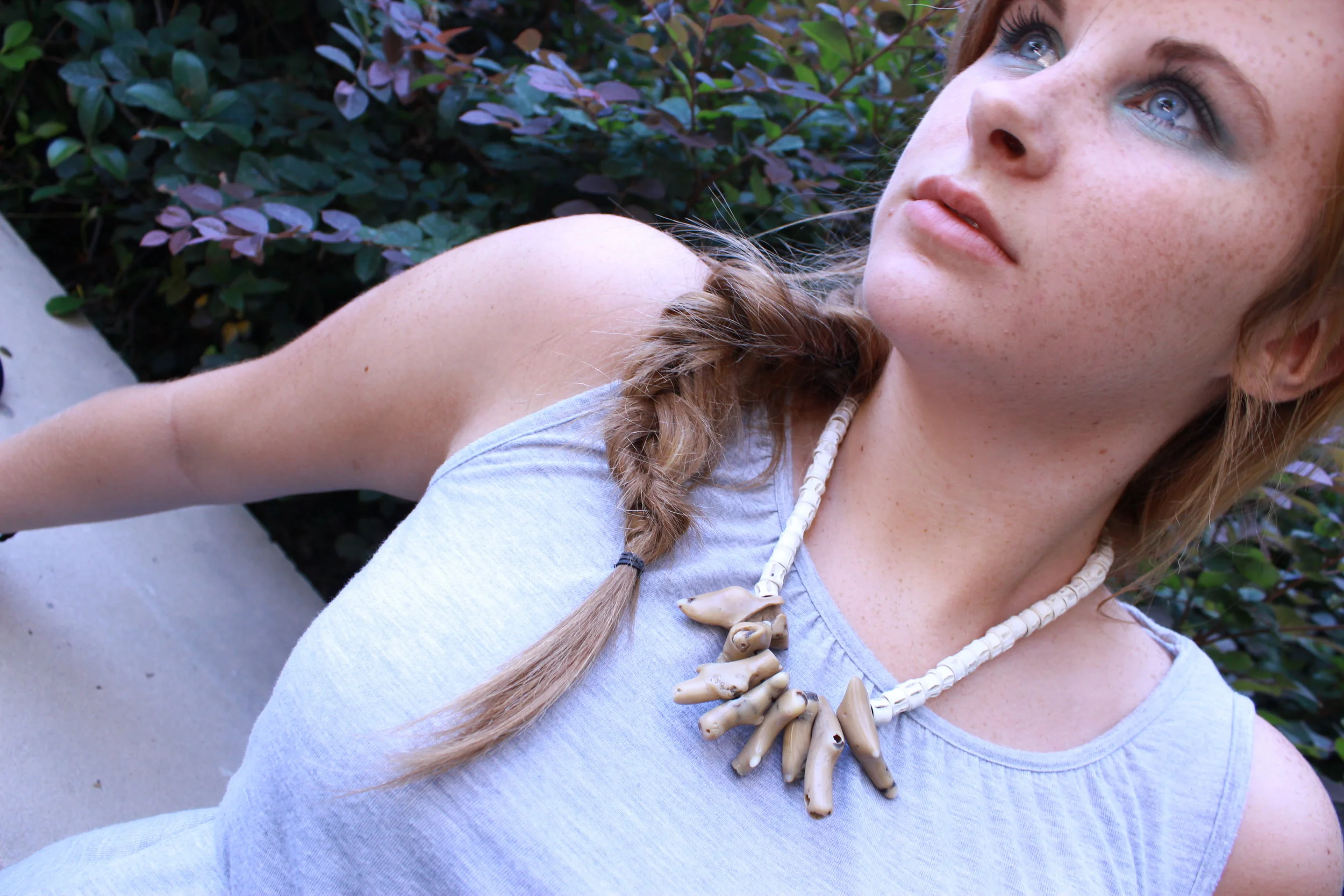 Jessie Broome modeling Fish Vertabrea & Coral Necklace
