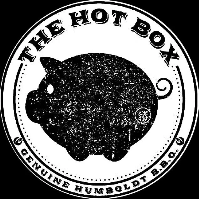 Logo for The Hot Box, a barbecue restaurant by Genuine Humboldt BBQ, featuring a silhouette of a pig within a circular badge.