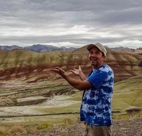 Nick Bader, Associate Professor of Environmental Geology Nick's interest in geology was sparked as a child after seeing the remains of prehistoric creatures at the Museum of Natural History in New York. After high school, he studied geology at Earlham College in Richmond, Indiana and earned Master's at the University of Arizona at Tucson. At the University of California at Santa Cruz, he earned my doctorate for his work on the influence of plants and soil microbes on the global carbon cycle, and on global climate. Nick's current research interest is paleosols (ancient buried soil horizons) and what they can tell us about past climate.