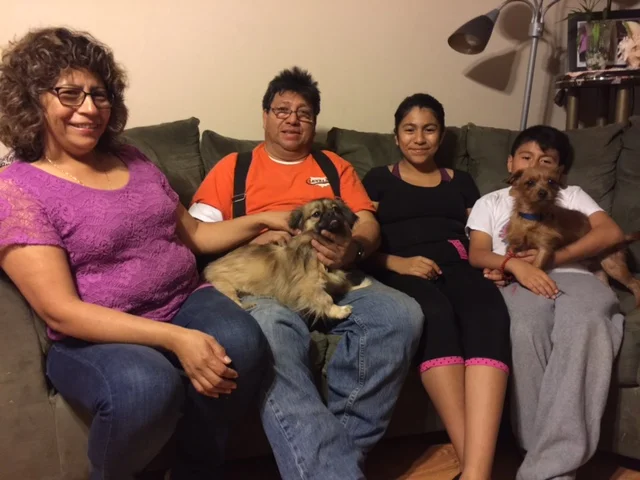 Dexter (on the right) with his new family