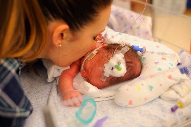 The first time I got to truly kiss my little man. Notice the nasty IV in his head. 