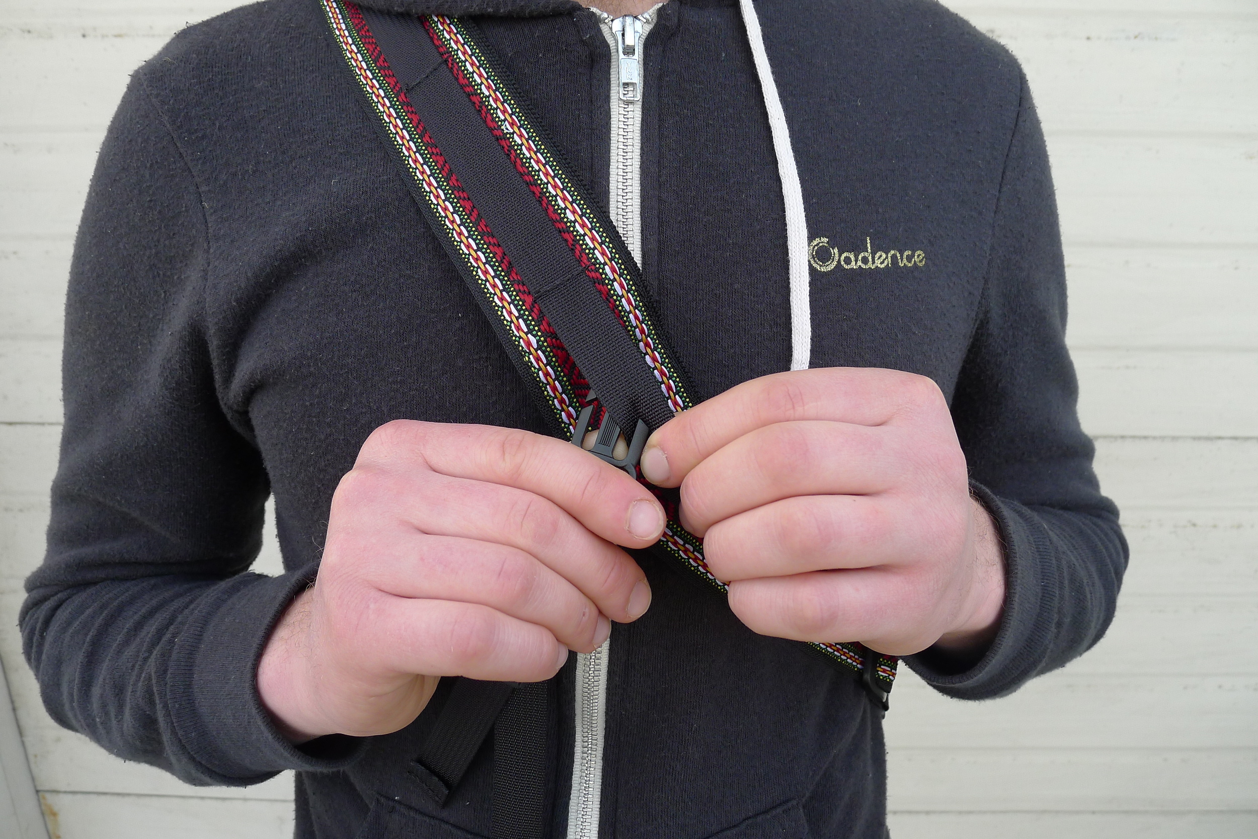 Attach one end of the cross strap so that the buckle is in a comfortable place in front of you