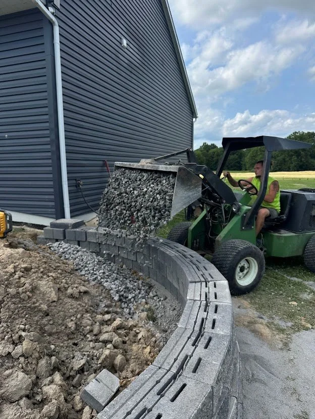 Backfilling behind new wall