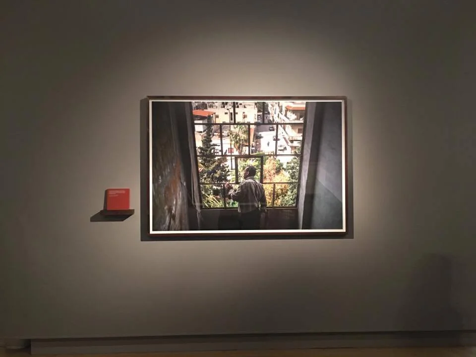 A man looking out from his window for a seemingly peaceful moment. The front line with open fire was only a block away.&nbsp;