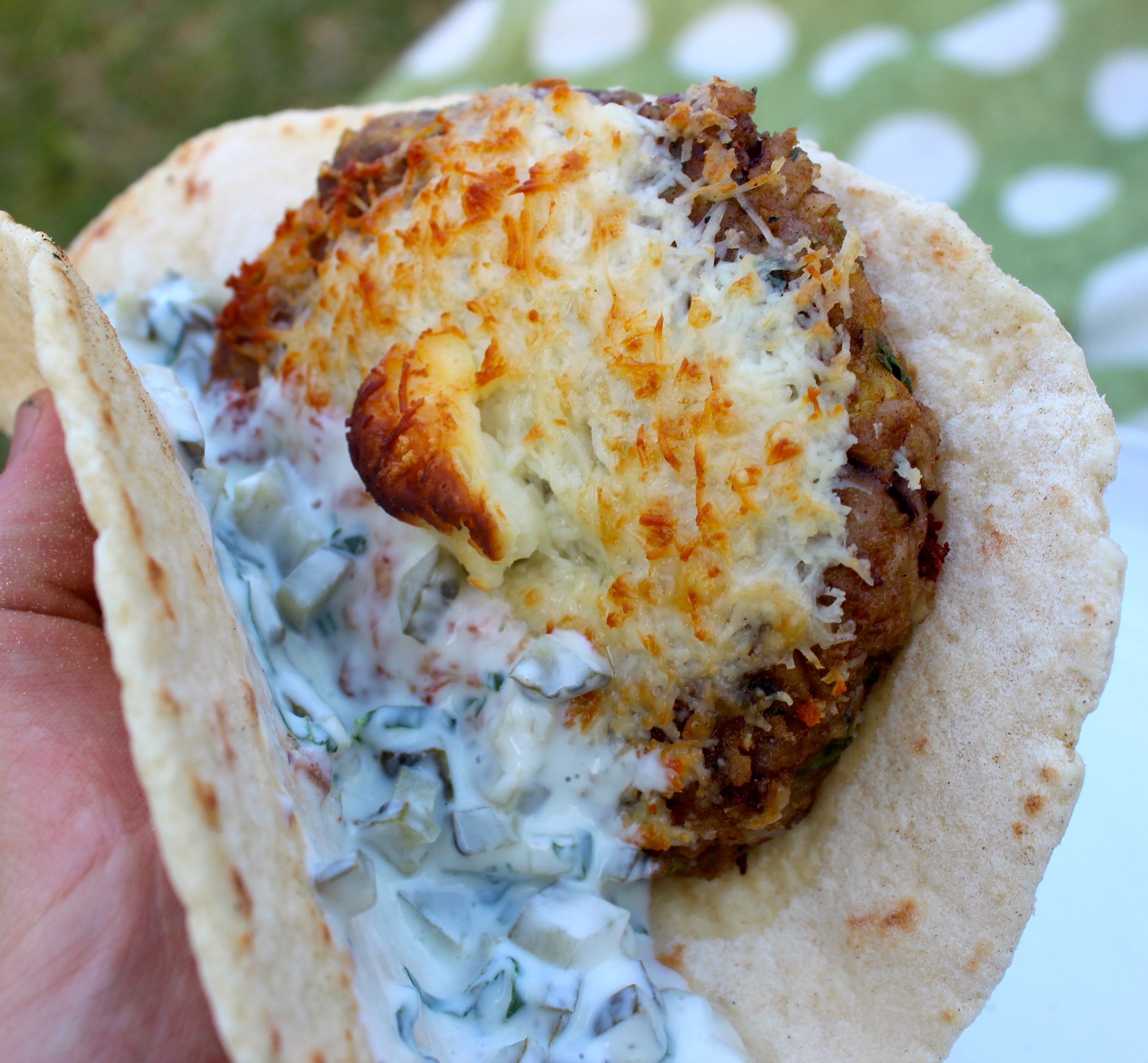 Epic bean burger in homemade flatbread with a basil and gherkin yoghurt