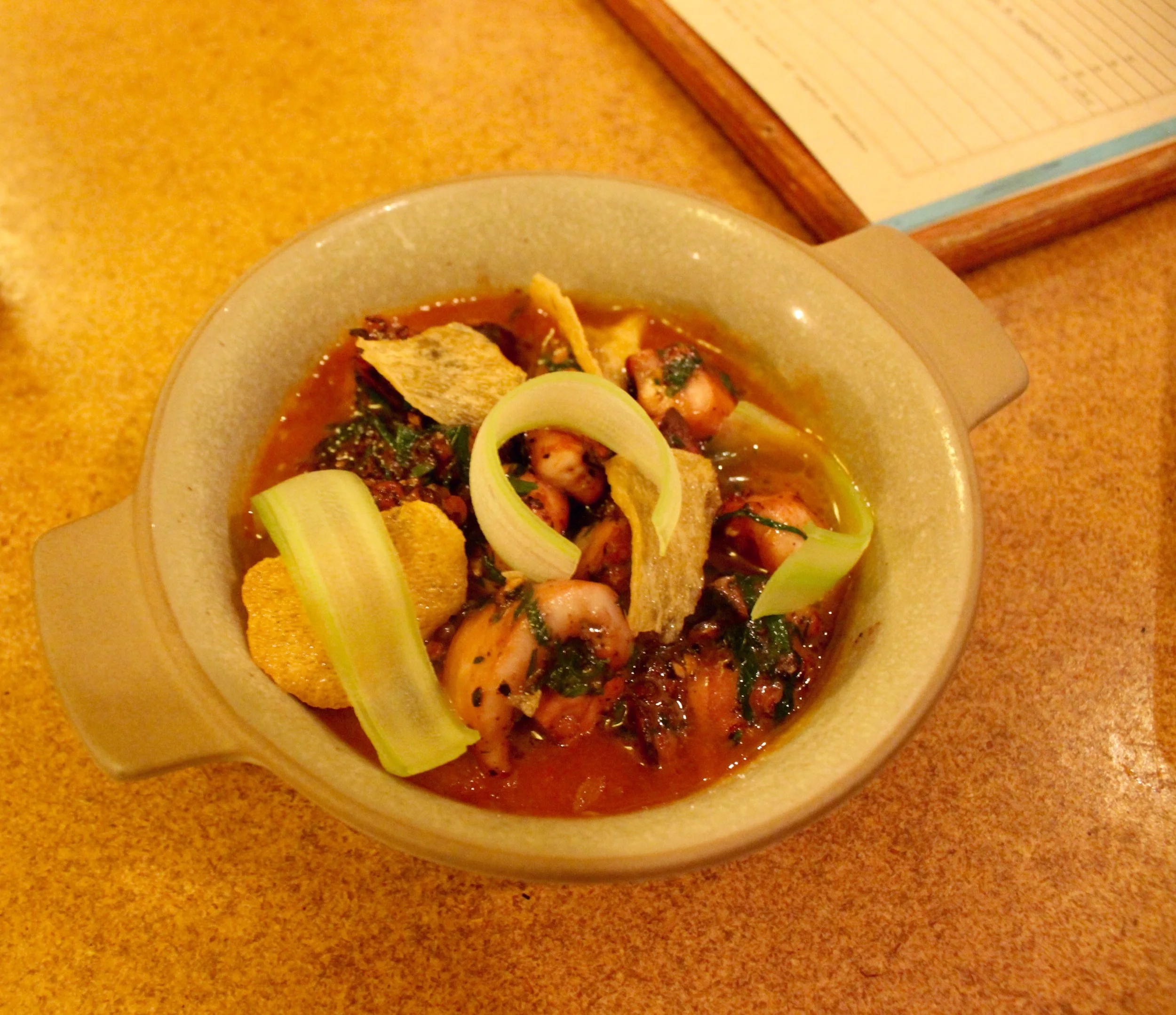 Charred Octopus with kampot peppercorn and tomato