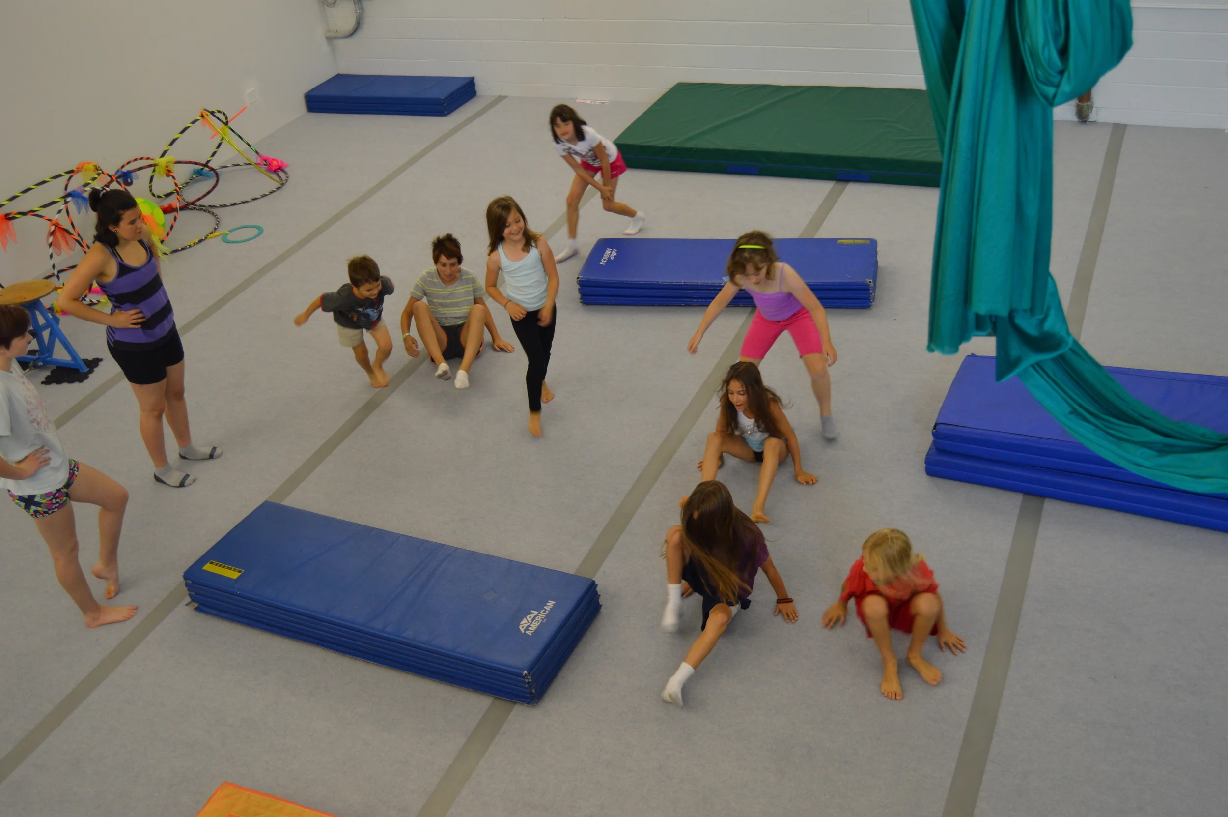 Come check out our awesome space - fully equipped with mats, aerial equipment, and circus props galore!