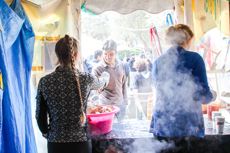 Volunteers handing out tea and cookies at the Tea Tent - Better Days for Moria Refugee Camp