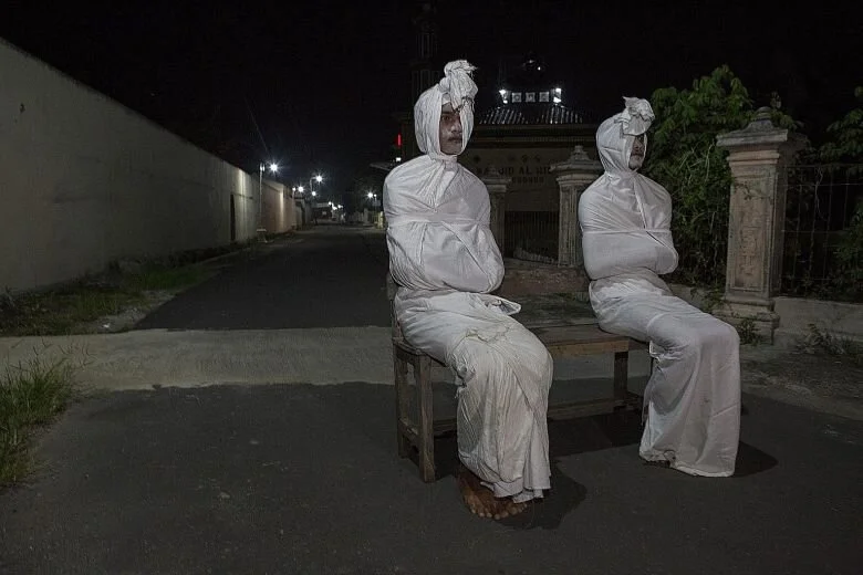 Indonesian village uses 'ghosts' for distancing patrols