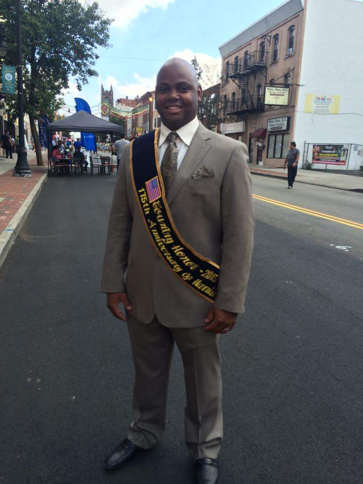 Jose Morillo, Country Honoree Dominician Republic Harrison Fest 2015 standing on Harrison Avenue closed to traffic on Saturday, September 19, 2015 after the Harrison 175th Anniversary Parade.