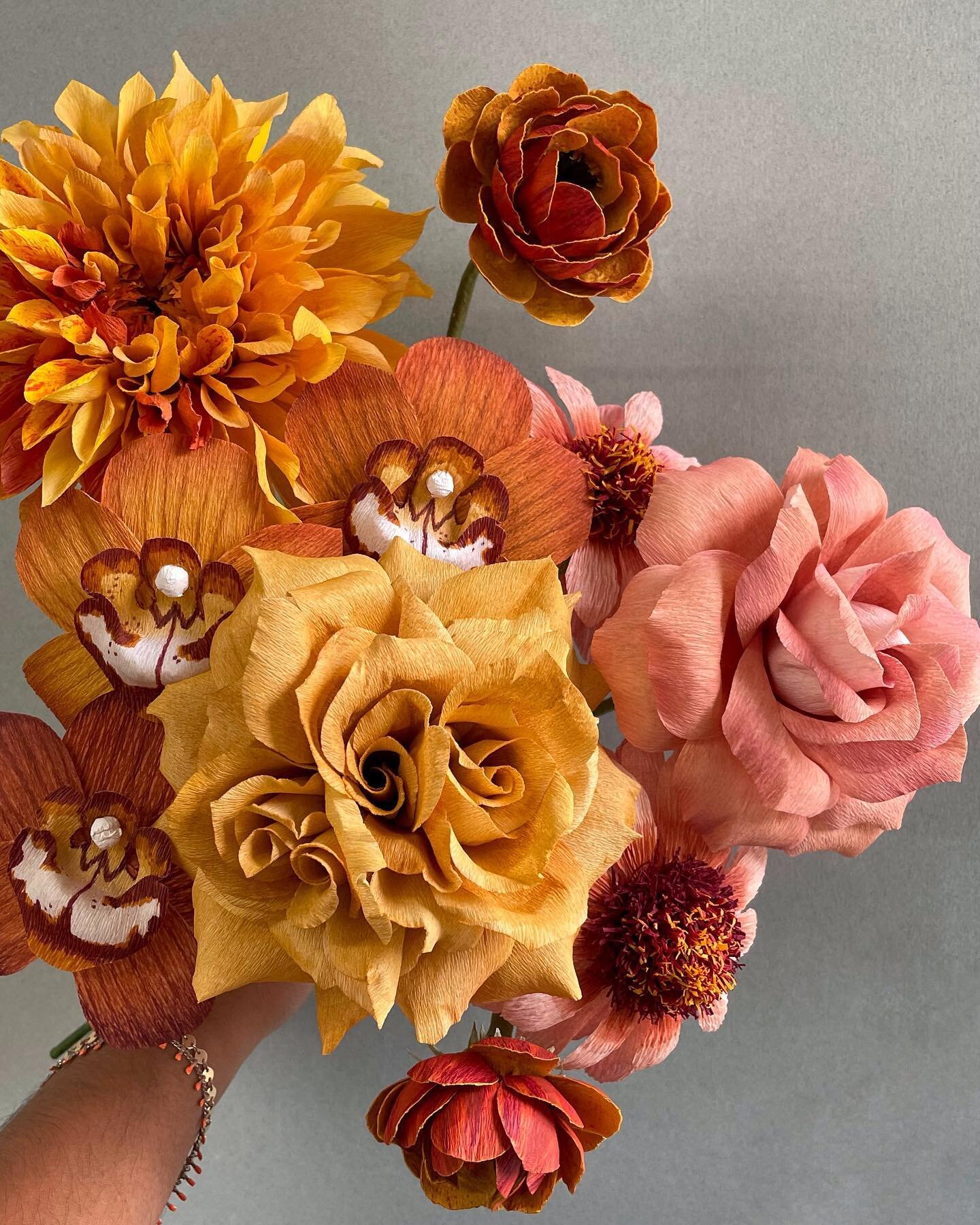 A weeks worth of work and I&rsquo;m so excited to keep adding to this collection of blooms. 🧡🤎 Every single flower in this upcoming still life will have to be hand painted to achieve these dusty warm tones and to be honest, I&rsquo;m not mad about it. ✨
.
Handmade paper flowers made with @cartefinicrepepaper and @liagriffith paper. Hand painted with @panpastel and alcohol inks. Flowers pictured: cross pollinated gold cafe au lait, mustard yellow and rust orchids, gold toffee rose, rust ranunculus, mauve classic rose, and dusty coral zinnias.