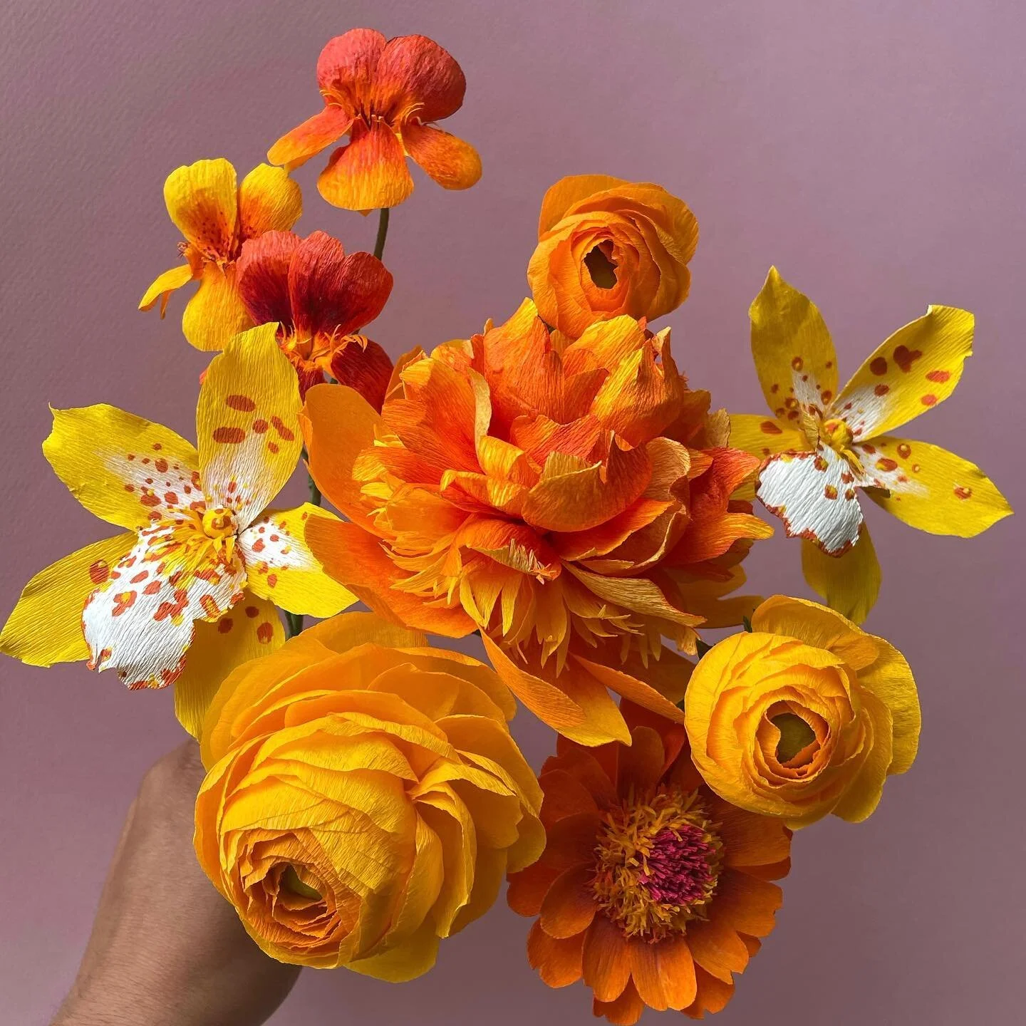 The last of the paper blooms for the newest Still Life addition to our Color Theory collection. I&rsquo;ve never loved yellow more than I do in this very moment. ✨ I can&rsquo;t wait to start arranging in the next two days! This is going to be intense but I&rsquo;m so excited!! ❤️🧡💛
.
Handmade paper flowers using @cartefinicrepepaper and @liagriffith paper. Hand painted with @panpastel , alcohol inks, and acrylic paint. Paper flowers pictured: orange and red nasturtiums, orange and yellow ranunculus, orange and yellow peony bomb, orange zinnia, and gold Oncidium Orchids 😍