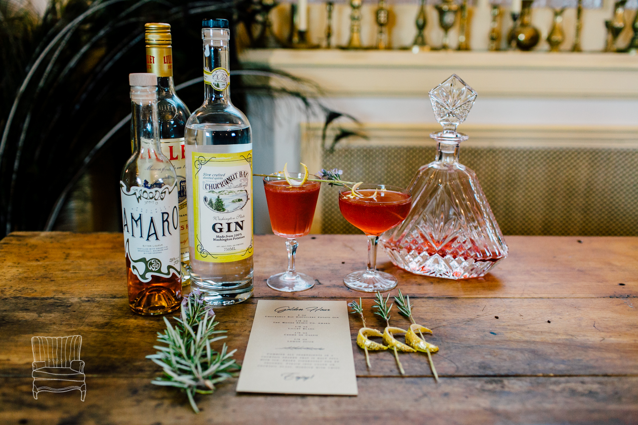 Winter Glamour wedding photo shoot featuring Sara Galactica's Golden Hour cocktail: Featuring Chuckanut Bay Distillery gin, The Woods Spirit Co. Amaro, Lillet Blanc, lemon juice, and gilded lemon crescents on rosemary skewers. Details: http://www.saragalactica.com Photo: Katheryn Moran Photography