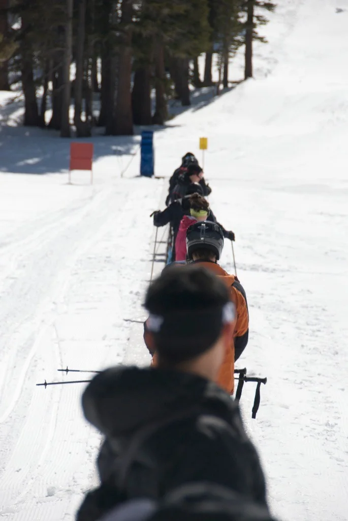 Catching a ride up the bunny slope