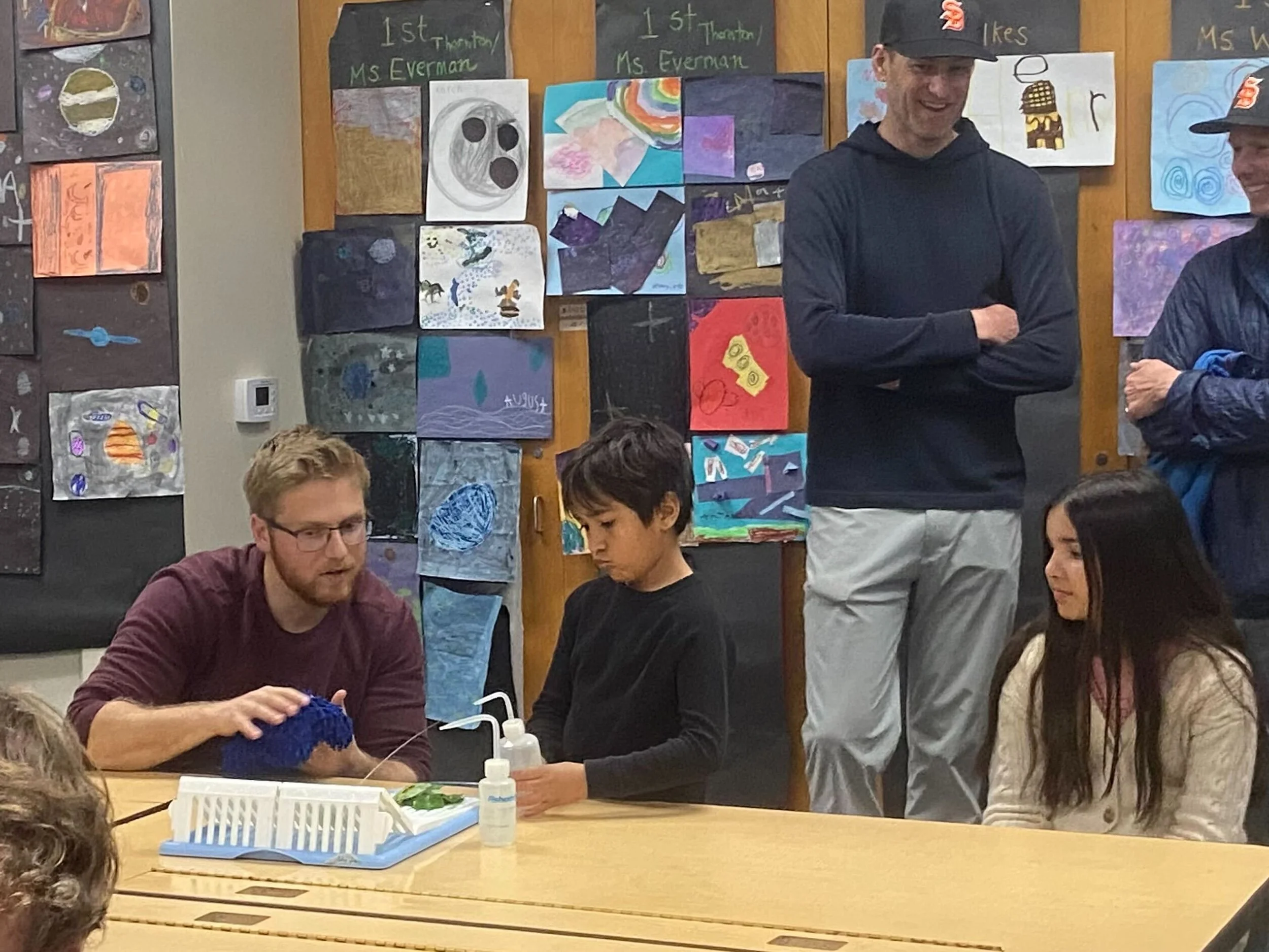 Liam is doing demo about hydrophobility with a lotus leaf.