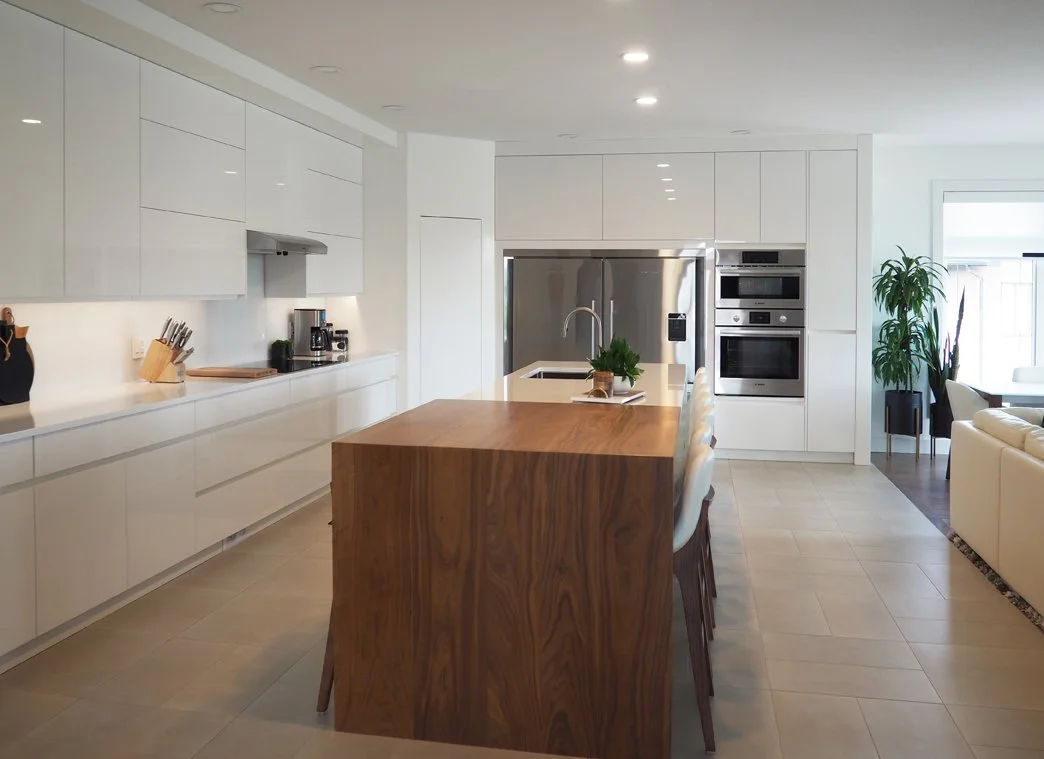 Gloss white and walnut kitchen