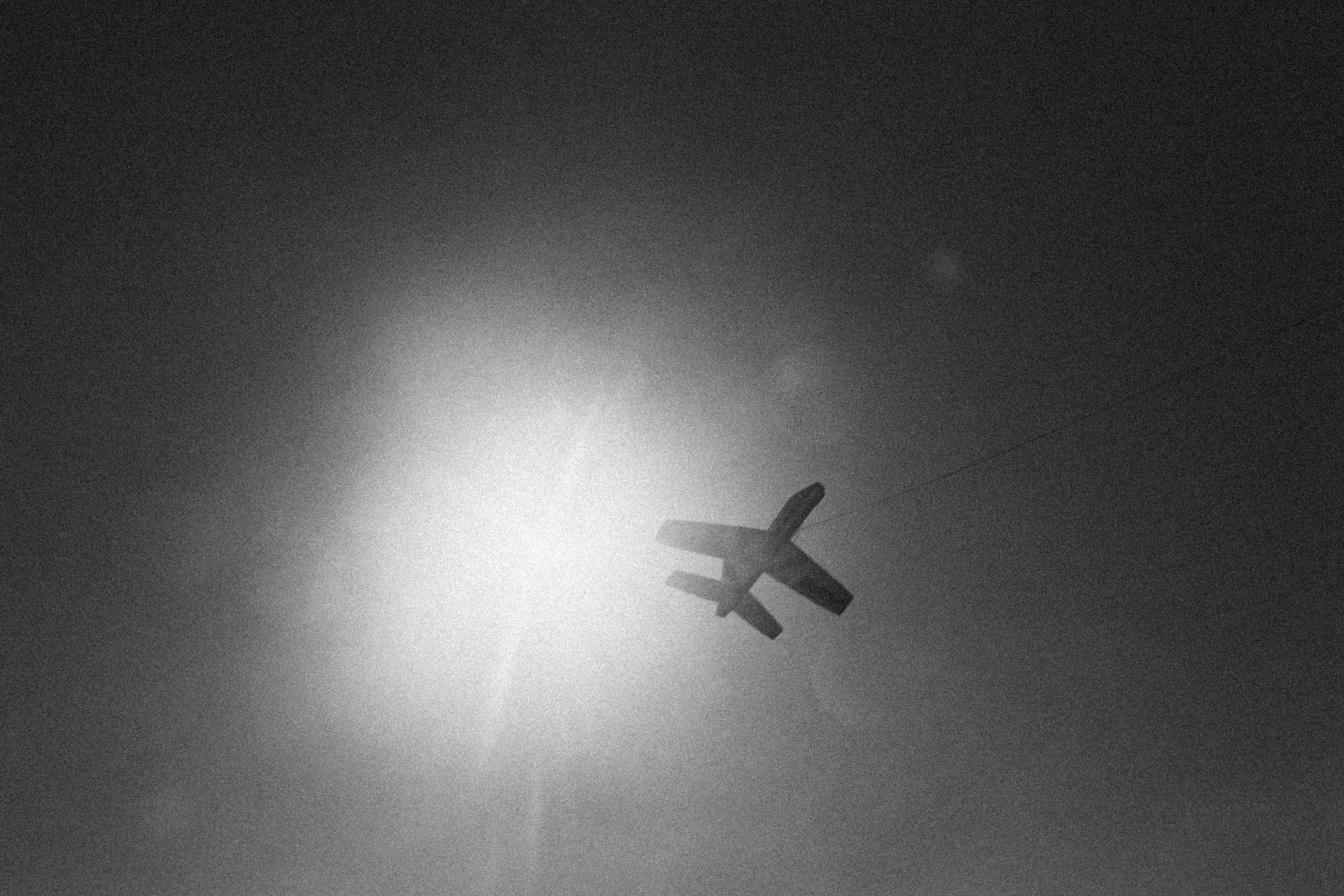 Paper plane being flown on a beach in Cartagena, Colombia. 2014