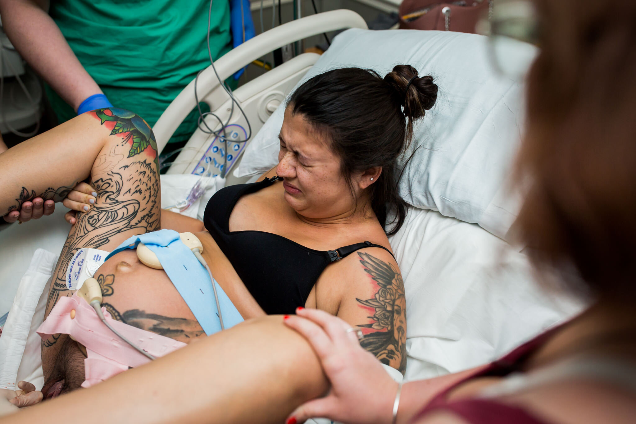 mom pushes through contraction during hospital birth