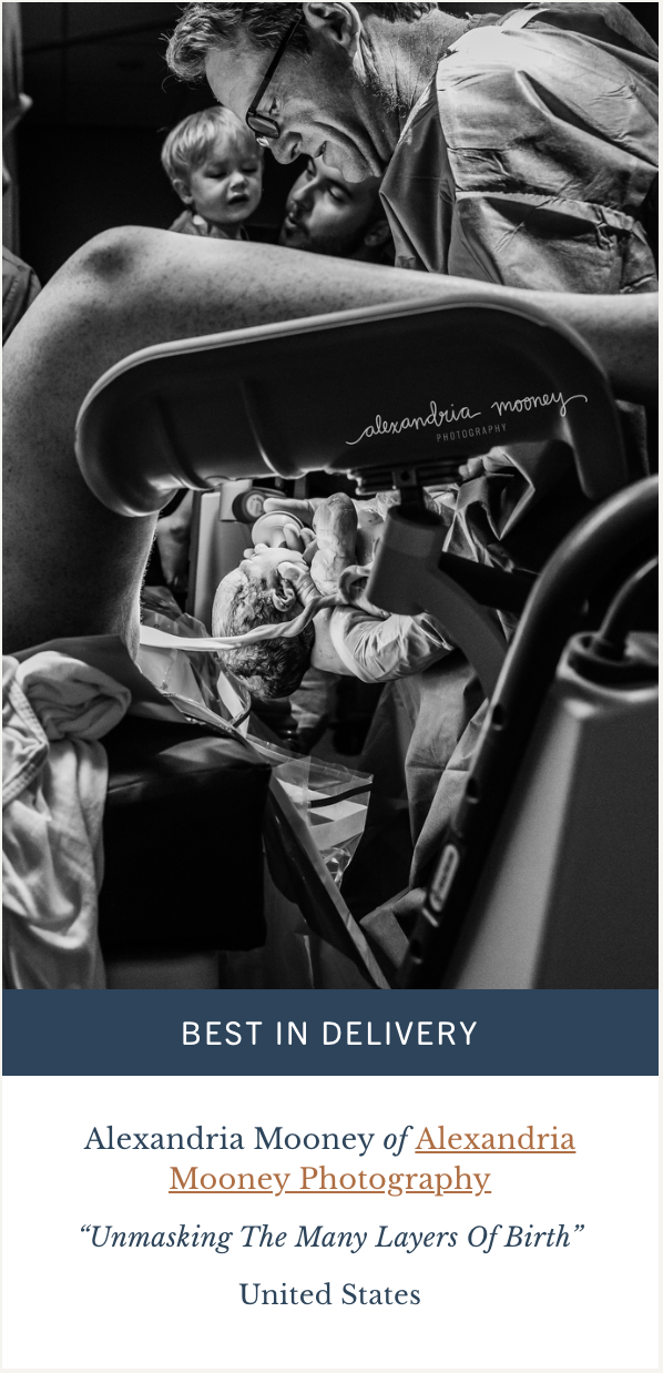 baby being delivered by doctor as father and brother watch on