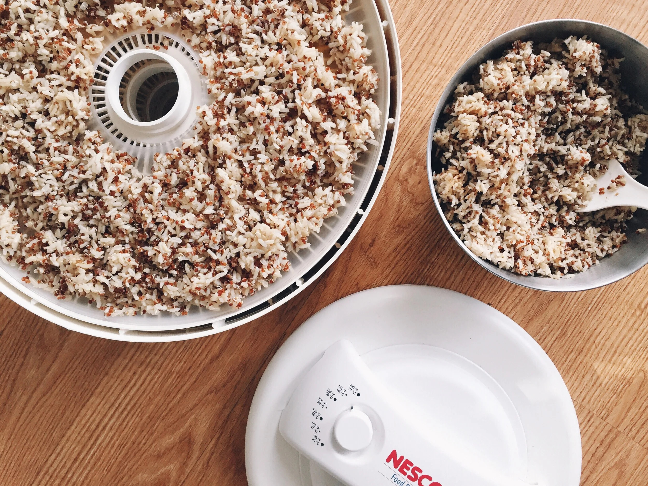 Preparing my pre-cooked organic brown rice and quinoa to be dehydrated for the next 5 hours.