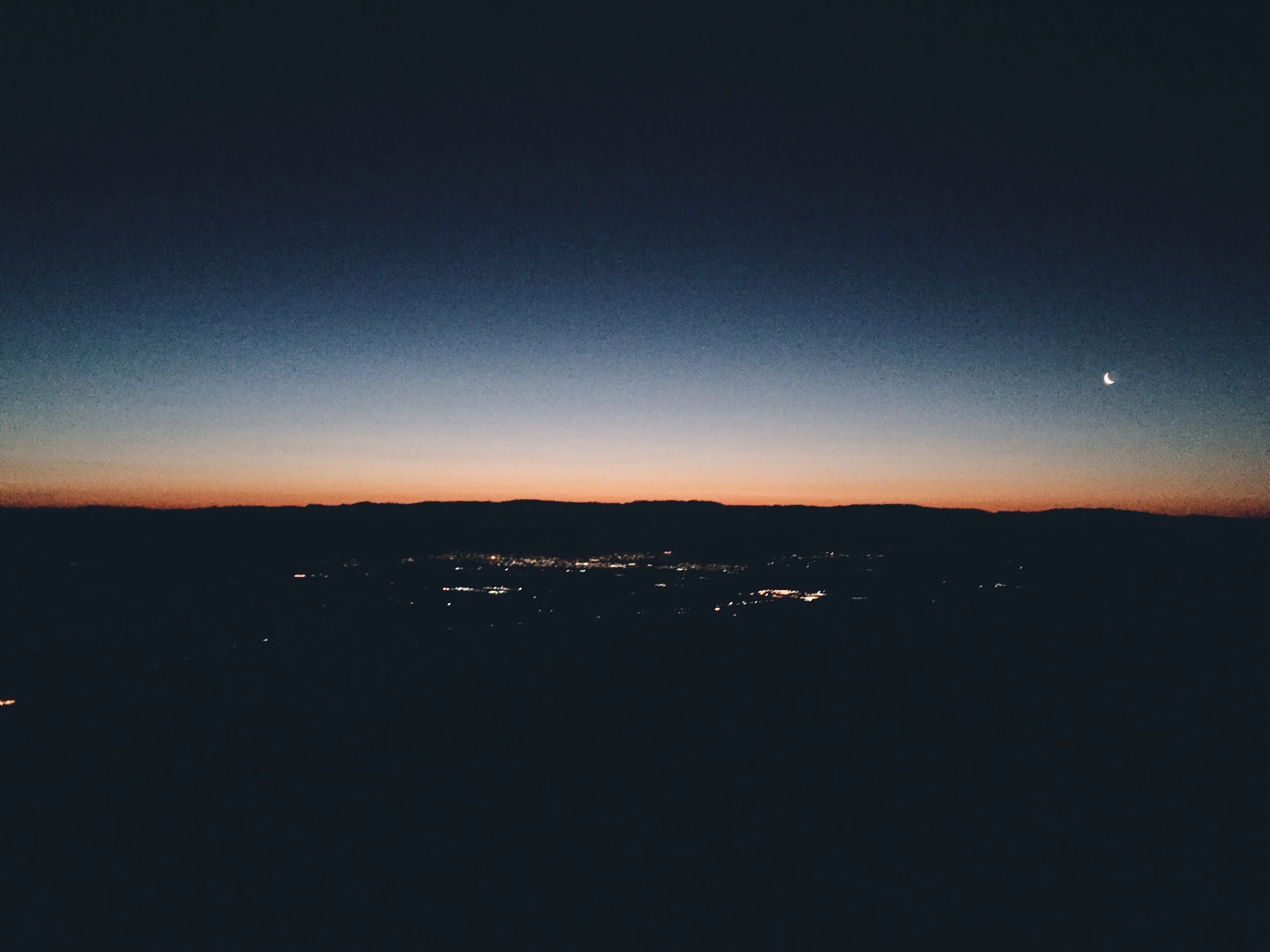 City light from Palm Springs and little bebe moon from my tent site. 