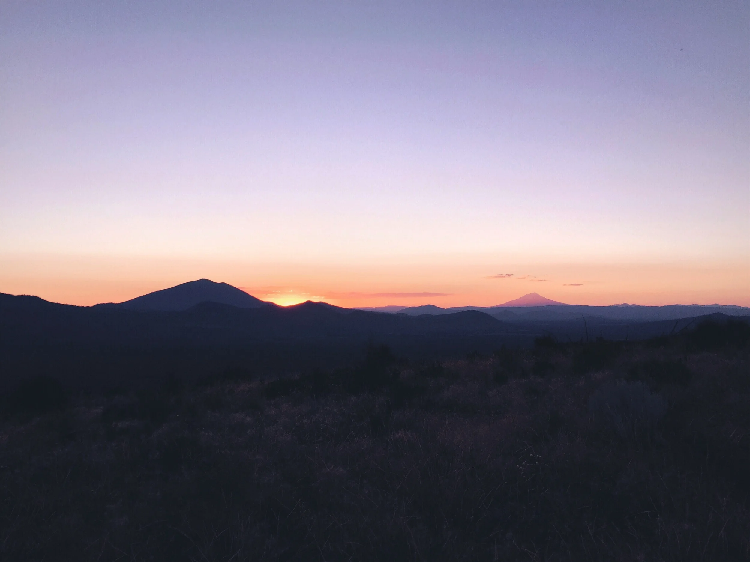 Sun setting with shasta in the distance.
