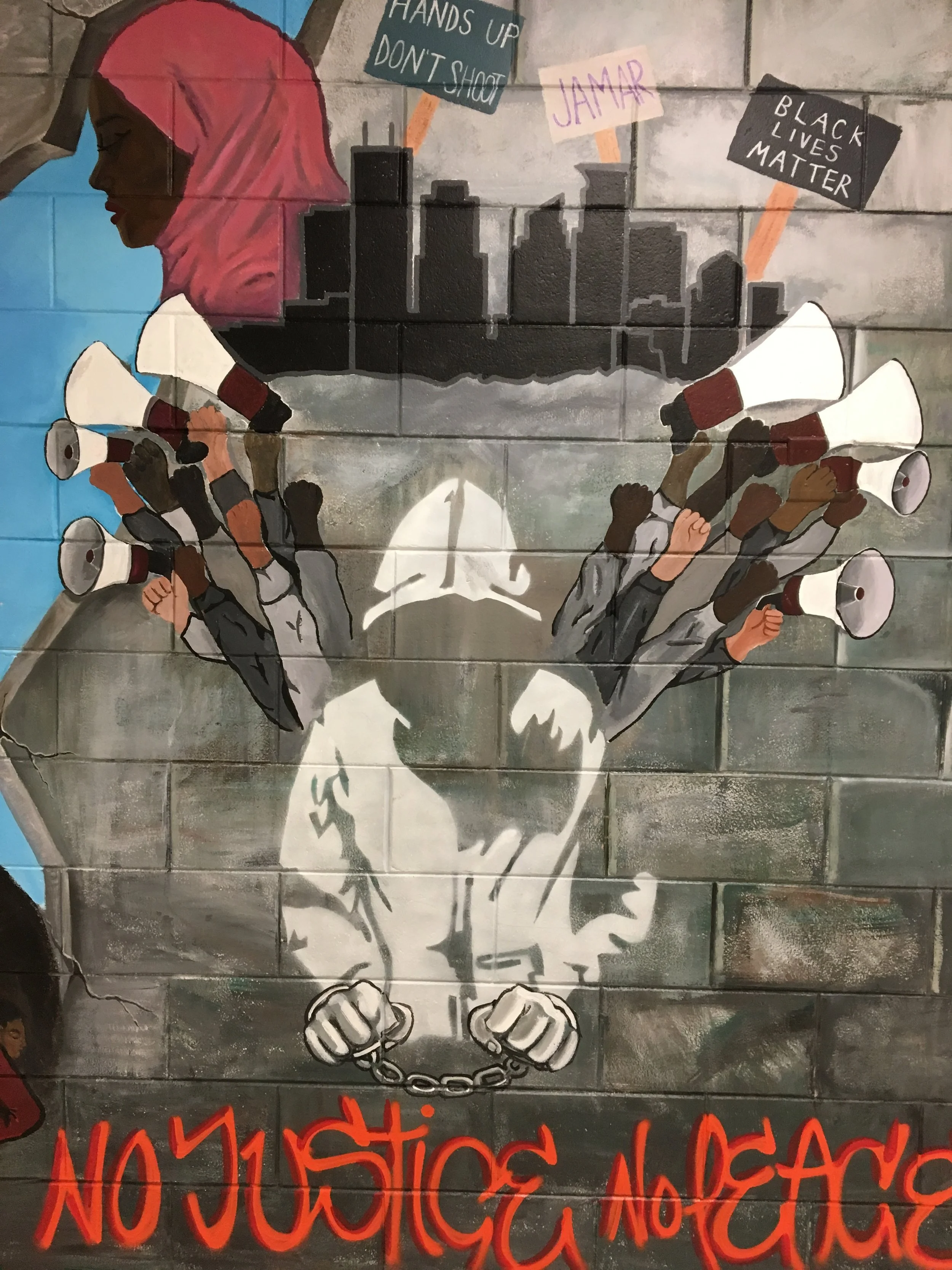 The mural runs the length of the wall and I could only capture half of it due to the narrow hallway
