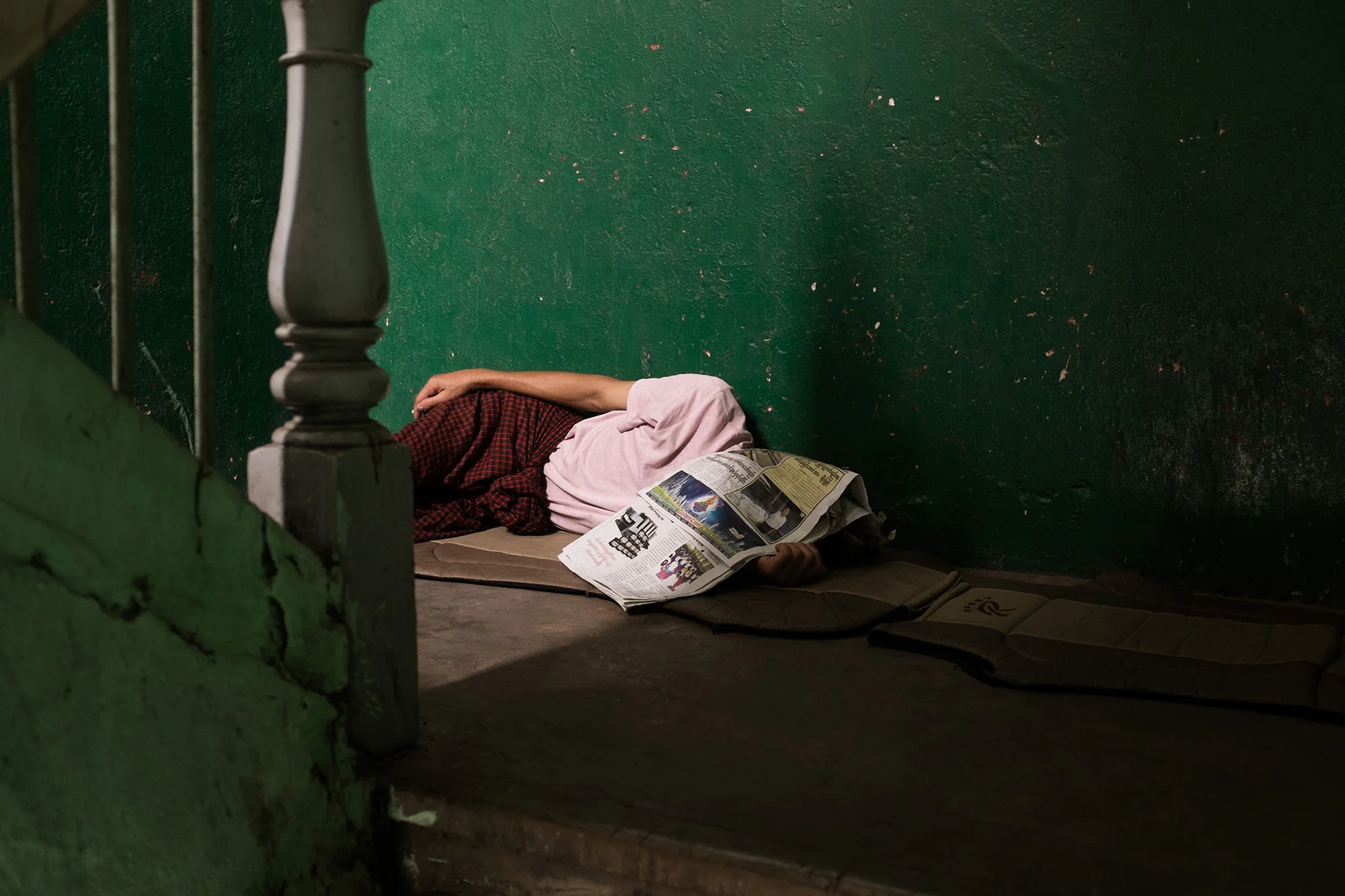 Asleep in a stairwell.