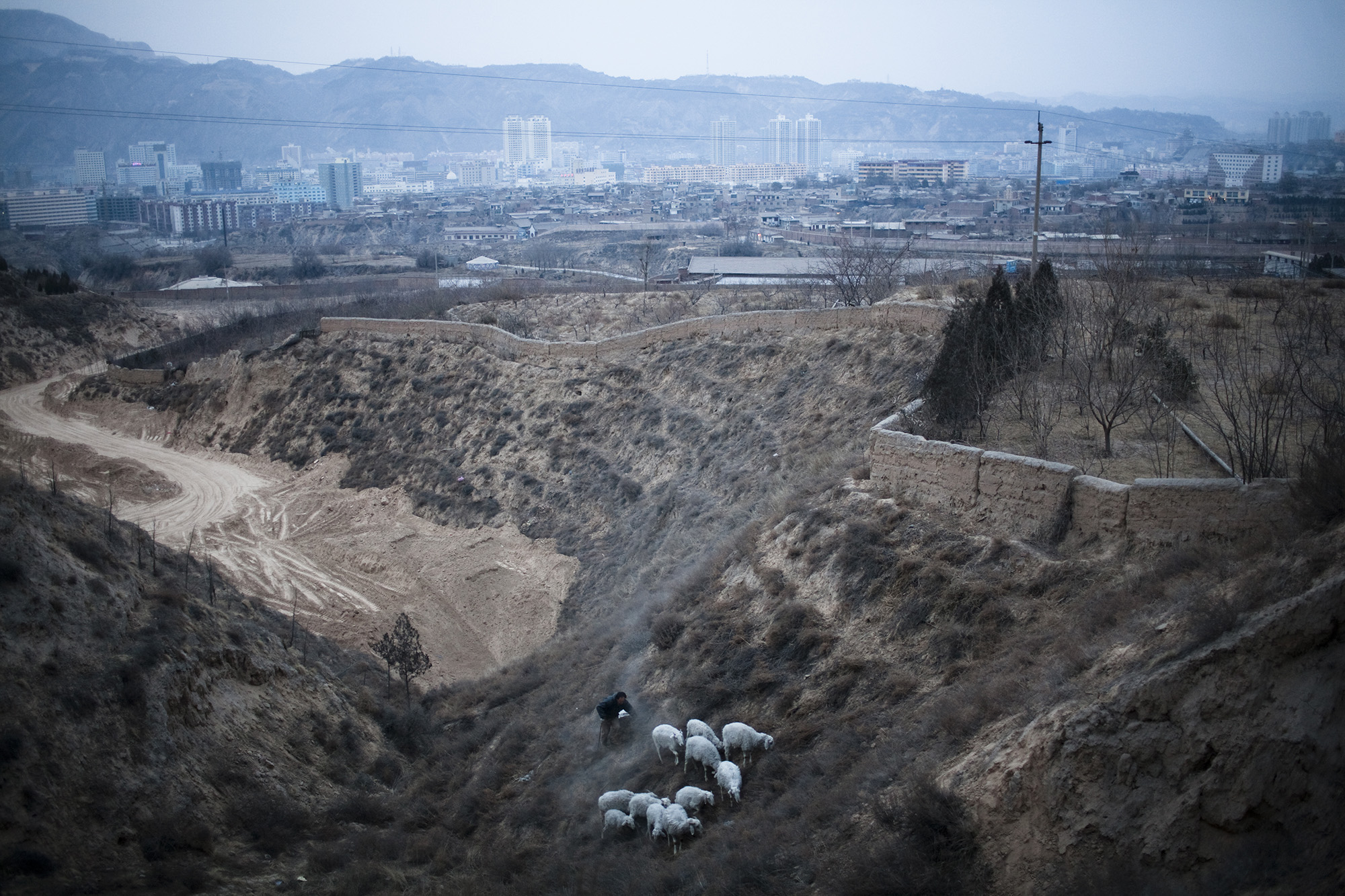   2009 - 2010  / Qi Lihe district sits on the outskirts of Lanzhou, a heavily polluted industrial city in Gansu Province, north-western China. It was home to thousands of migrant families from the Hui and Dongxiang Muslim minorities, who have left th