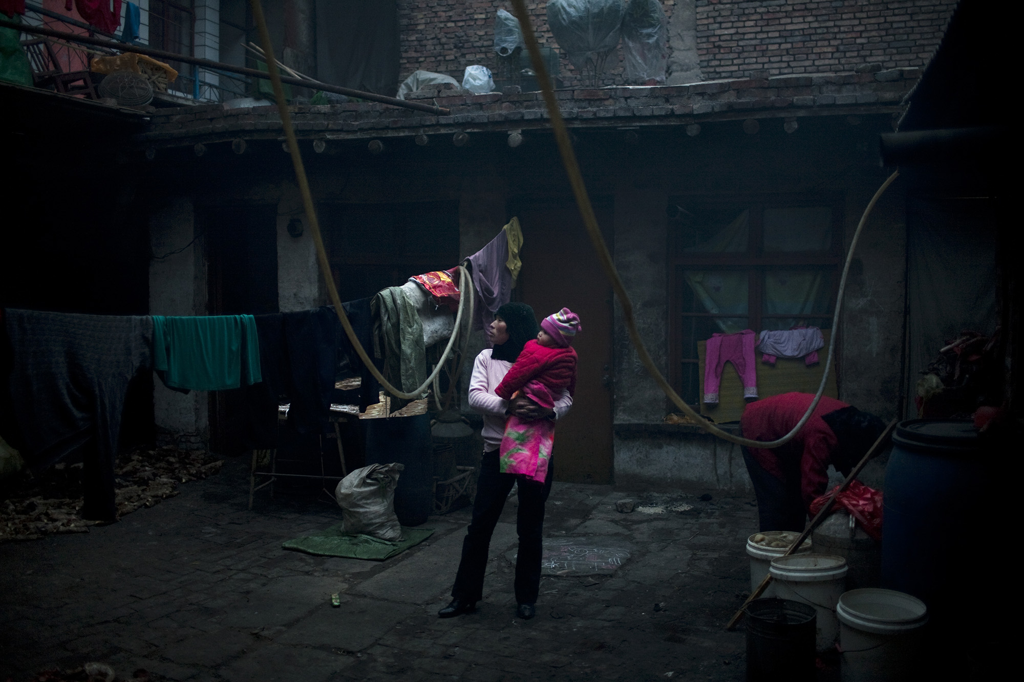 A mother holds her child.