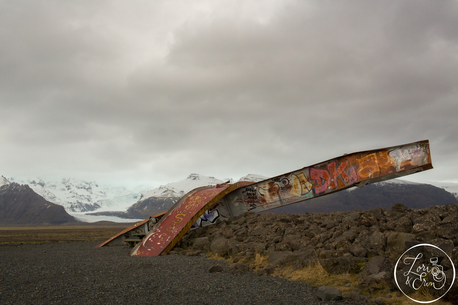  Remnants of a bridge with a glacier in the background 
