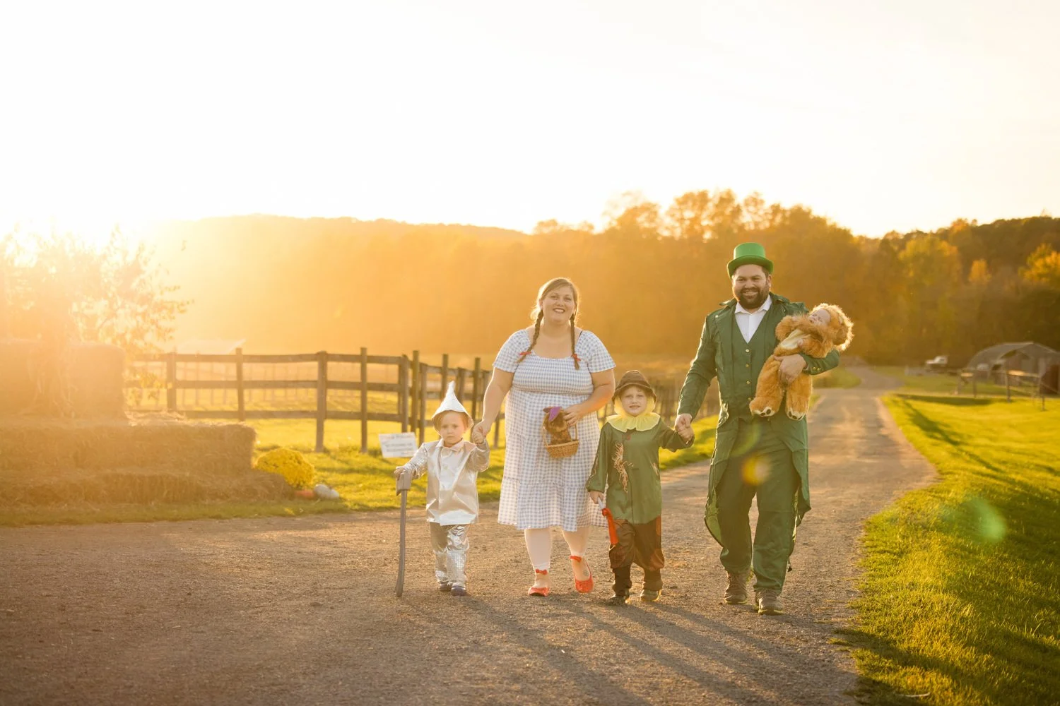 Candid family pictures at Chase Farms in Fairport NY featuring costumed family at sunset