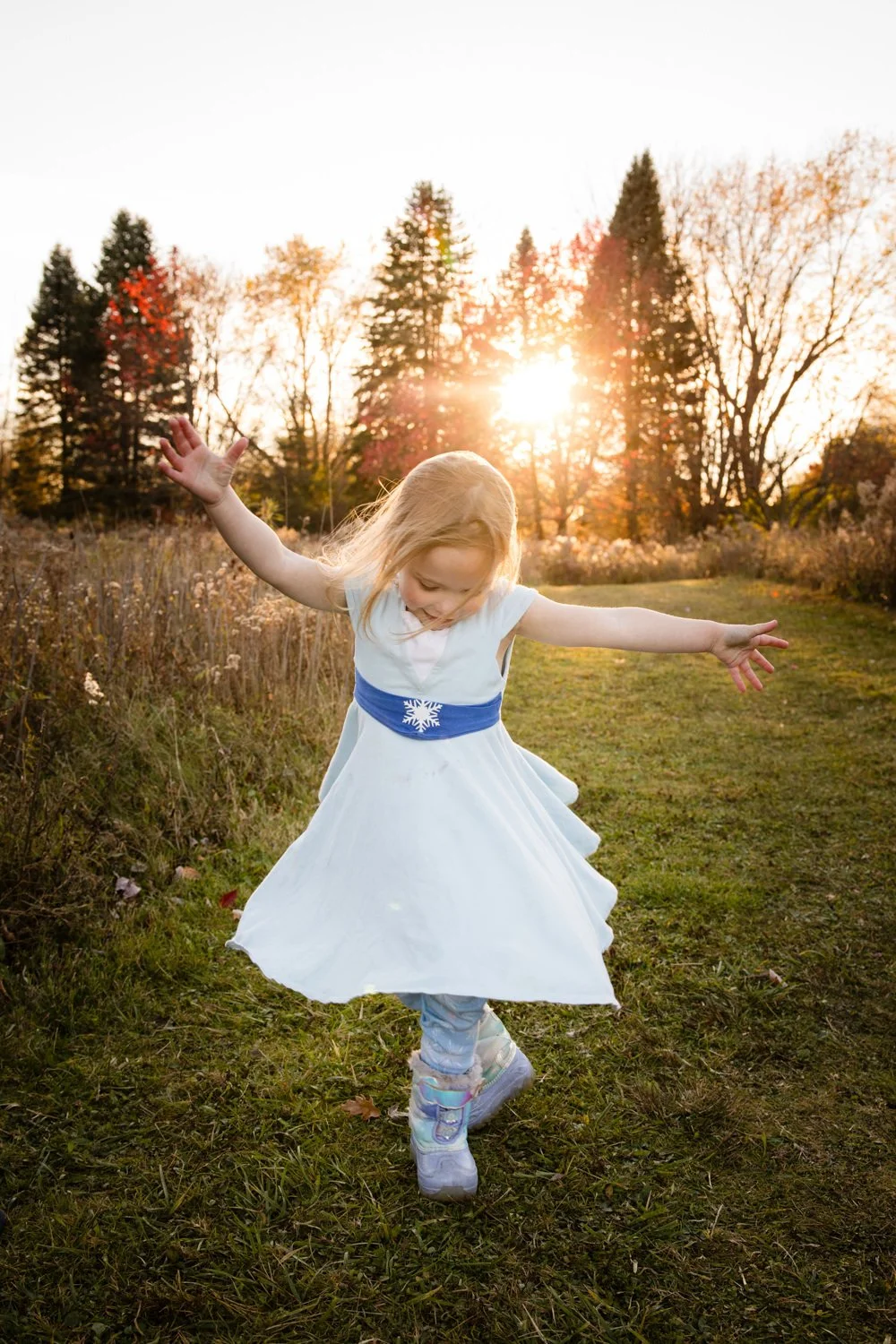 Family pictures at Tinker Park in Rochester NY featuring girl dancing at golden hour