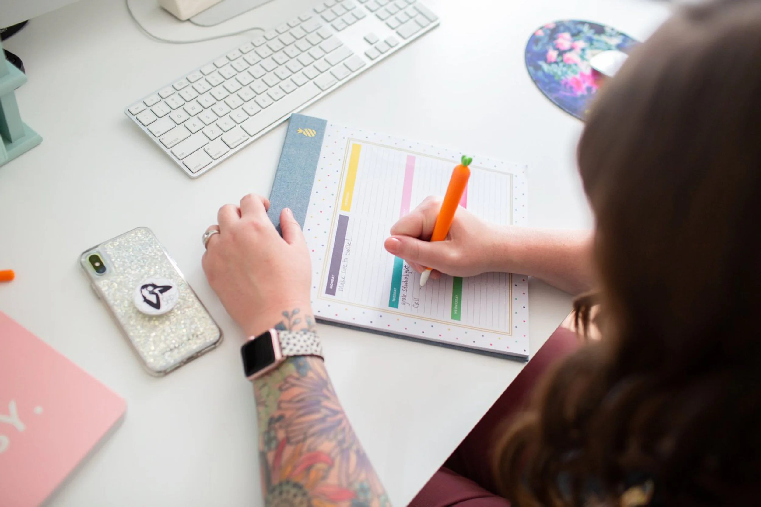 a branding photograph of a woman writing a to do list