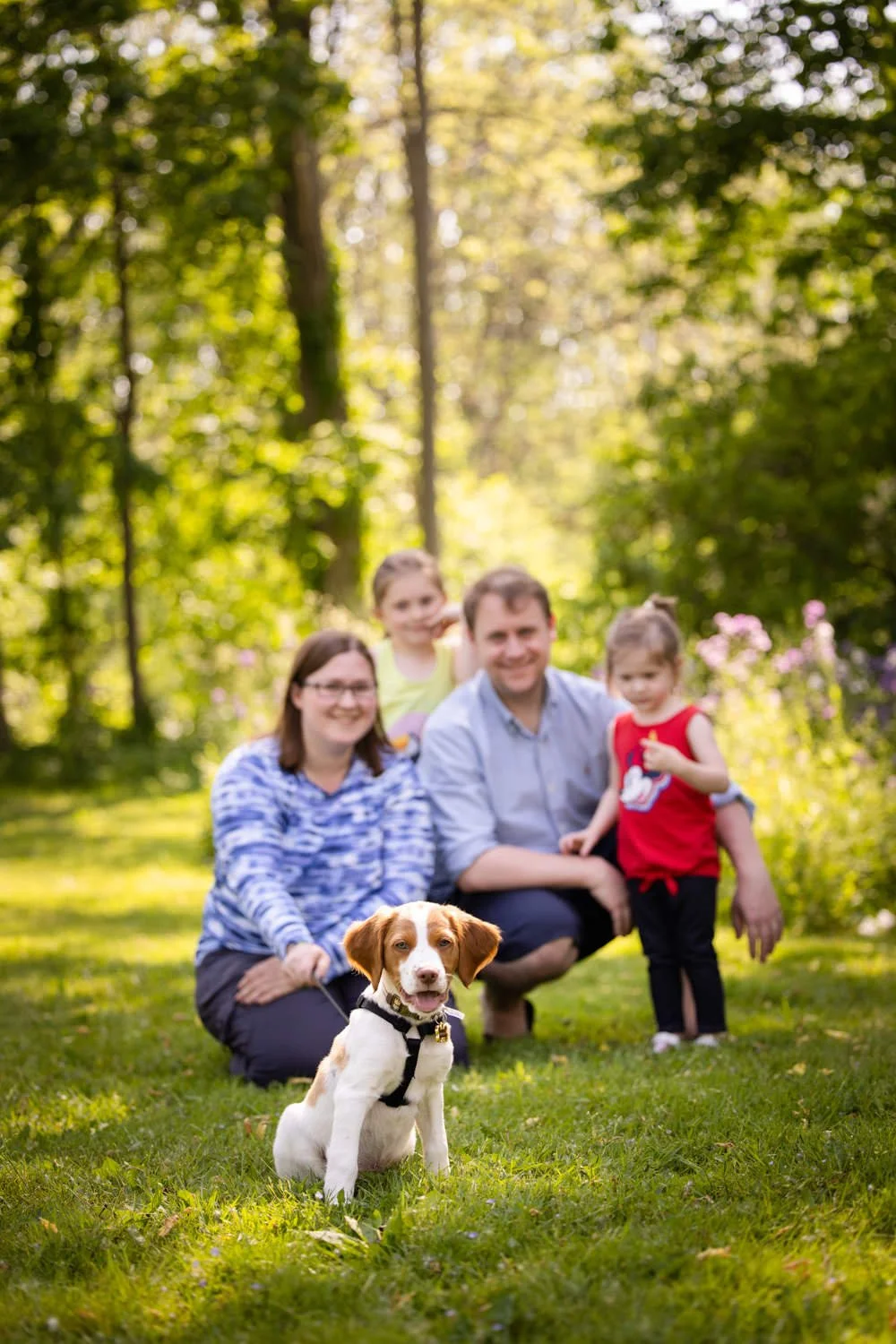 Penfield NY family photo session capturing parents, children, and puppy outdoors