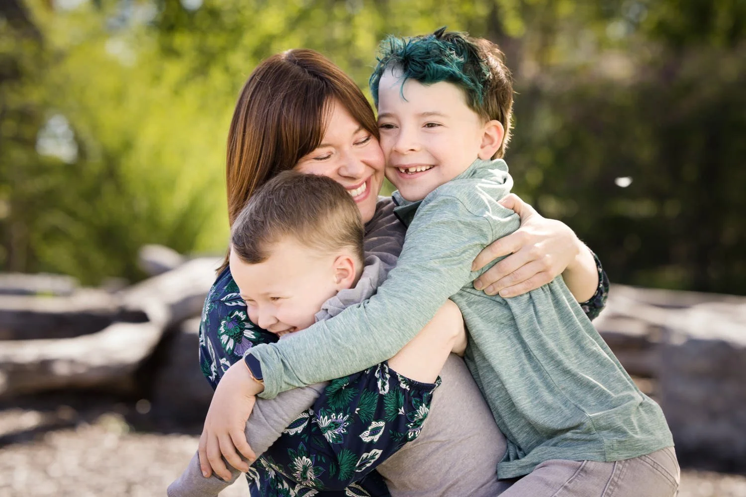 Mom hugging two young boys during family pictures at Highland Park in Rochester NY