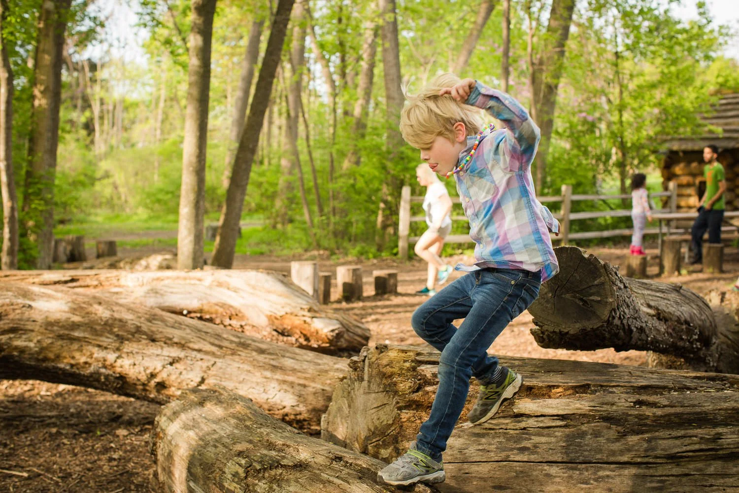 Rochester NY family photography at Abraham Lincoln Park highlighting adventurous outdoor moment