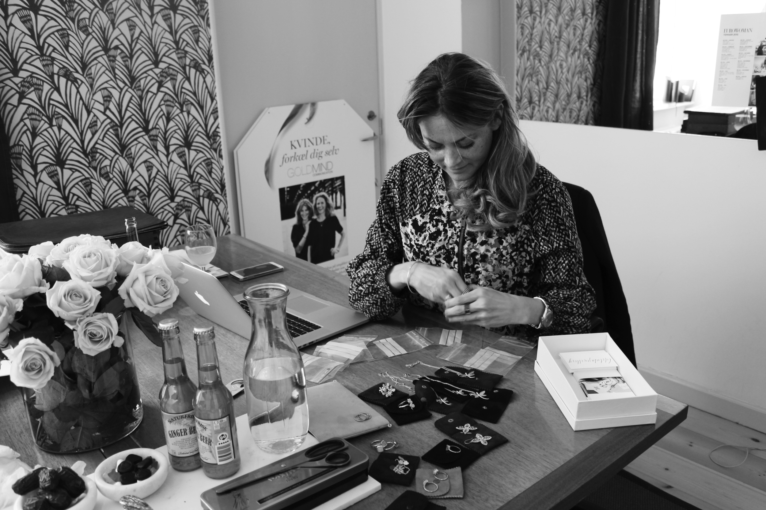 Charlotte from Goldmine trying on a titanium and diamond bracelet from Libelula jewellery.