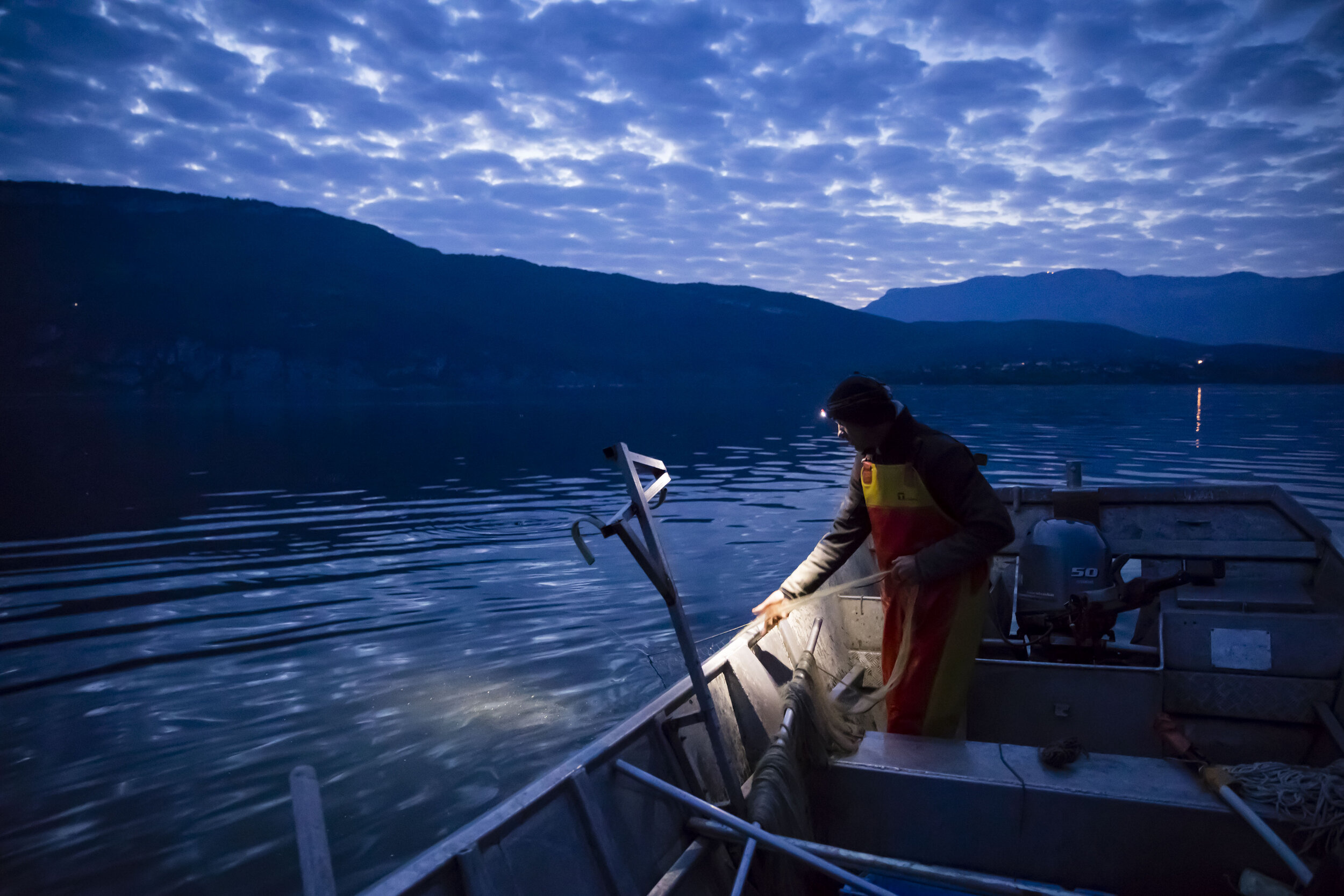   ©Vincent Isoré / IP3 ; Brison-Saint-Innocent, France April 25, 2020 - Professional fisherman Mickael Ranson continues to work during the confinement period, he raises his nets in Lac Du Bourget in the early morning.  