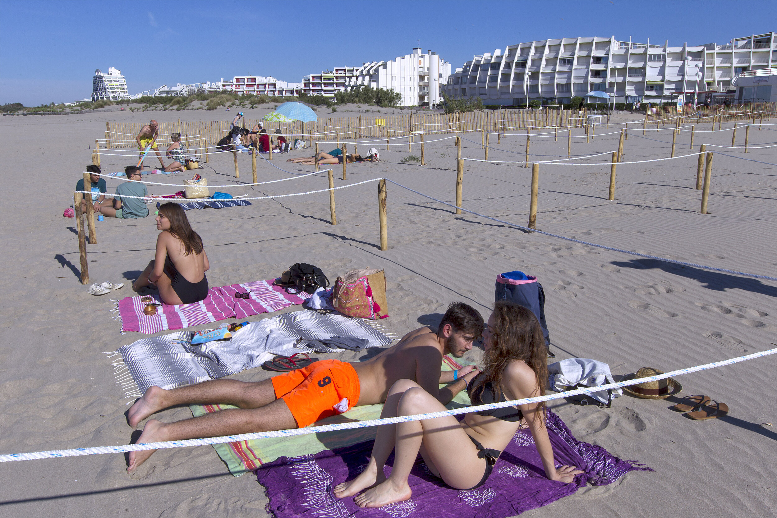   © Guillaume Bonnefont / IP3, La Grande Motte, France on May, 21, 2020. Opening of the first shared beach in France where it is possible to lie on your towel in passive mode. The town of La Grande Motte has set up a stretch of beach to respect the s